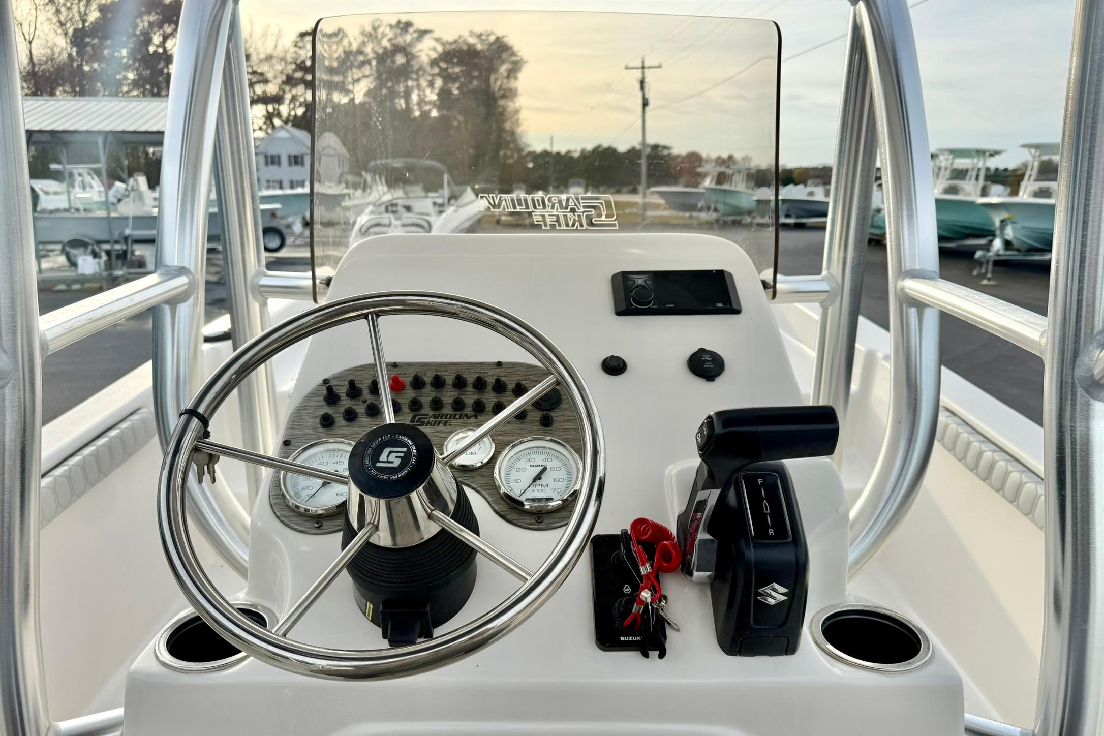 2025 Carolina Skiff 21 LS boat console with steering wheel and controls.