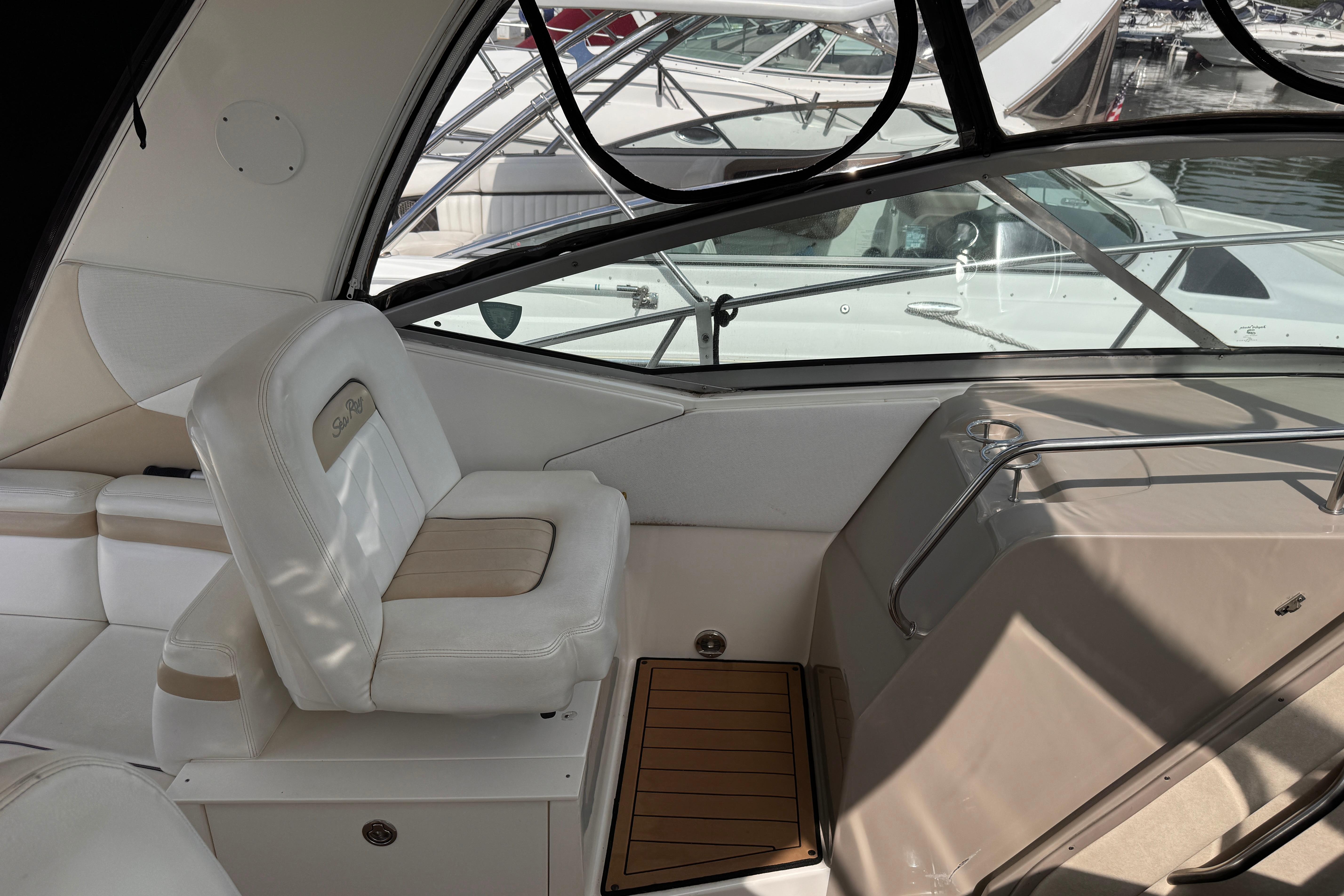 Interior of a 2008 Sea Ray Sundancer 350 yacht, featuring white seating and sleek design.