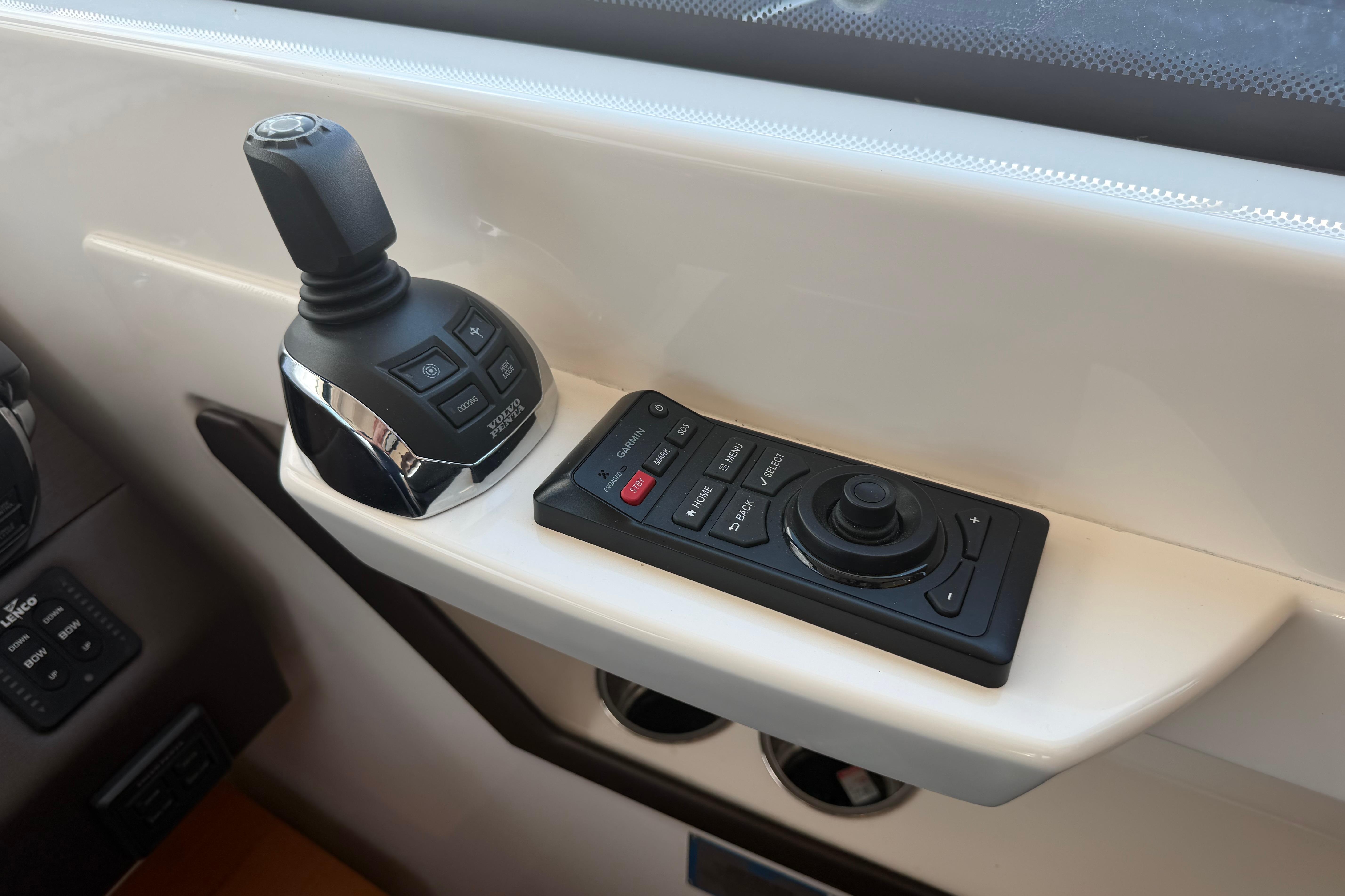 Control panel of a 2016 Tiara Yachts C39 Coupe, featuring joystick and navigation controls.