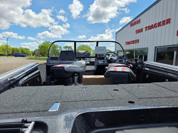 2025 Nitro ZV-20 SPORT boat interior at dealership, under a bright blue sky.