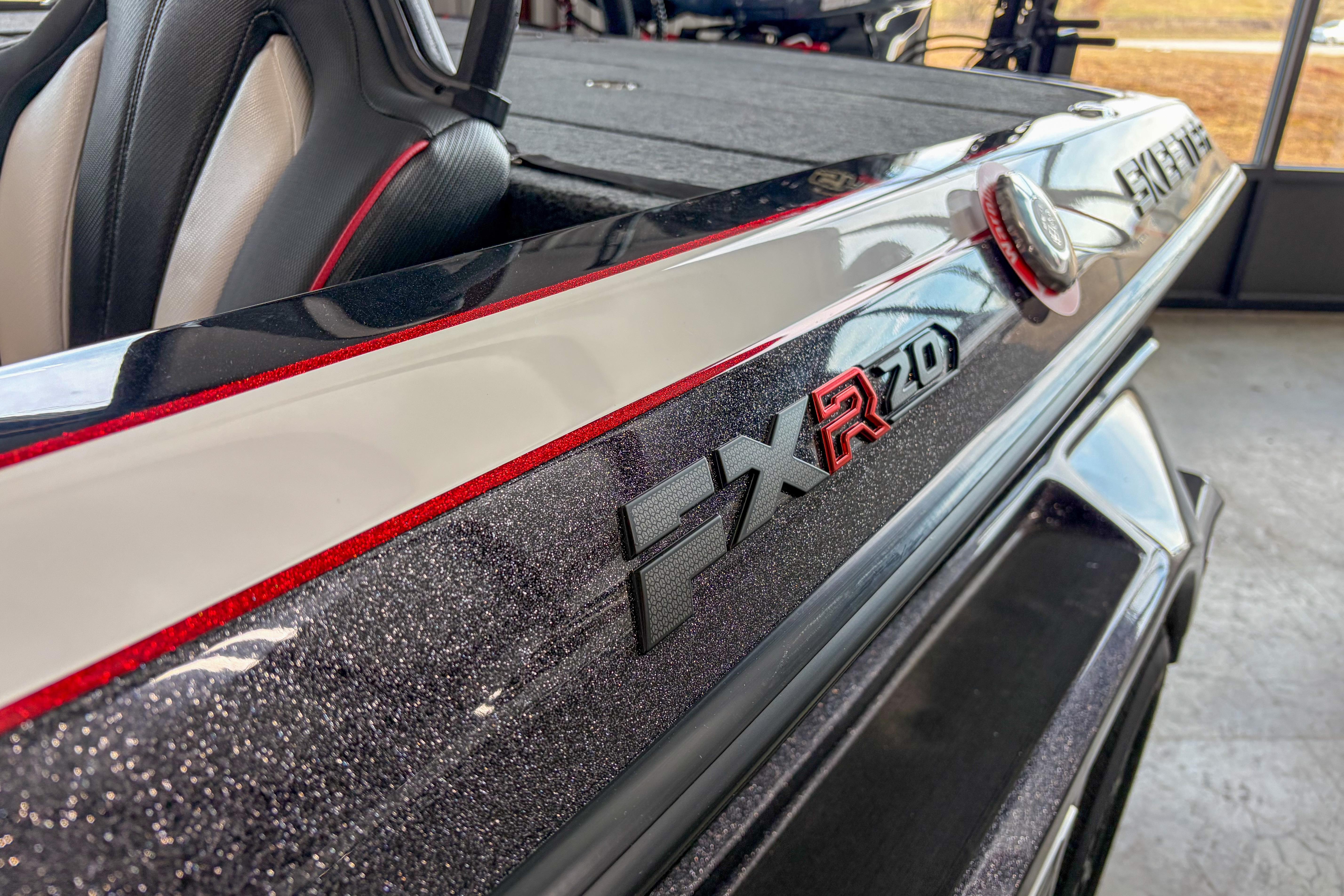 2026 Skeeter FXR20 FLEX boat, close-up of sleek design and logo detailing.