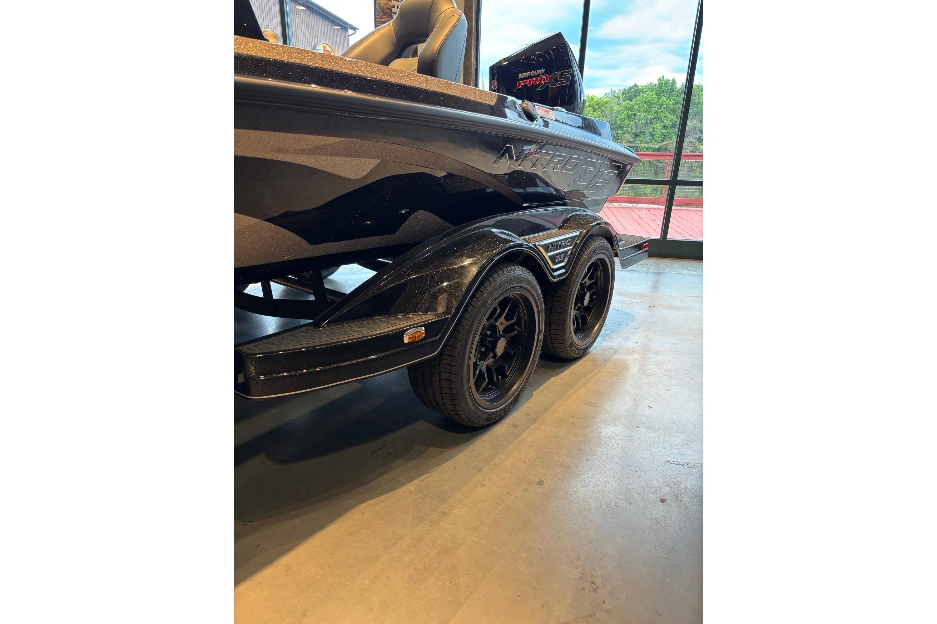 2026 Nitro Z19 XL Pro boat on display, featuring sleek design and dual axle trailer.
