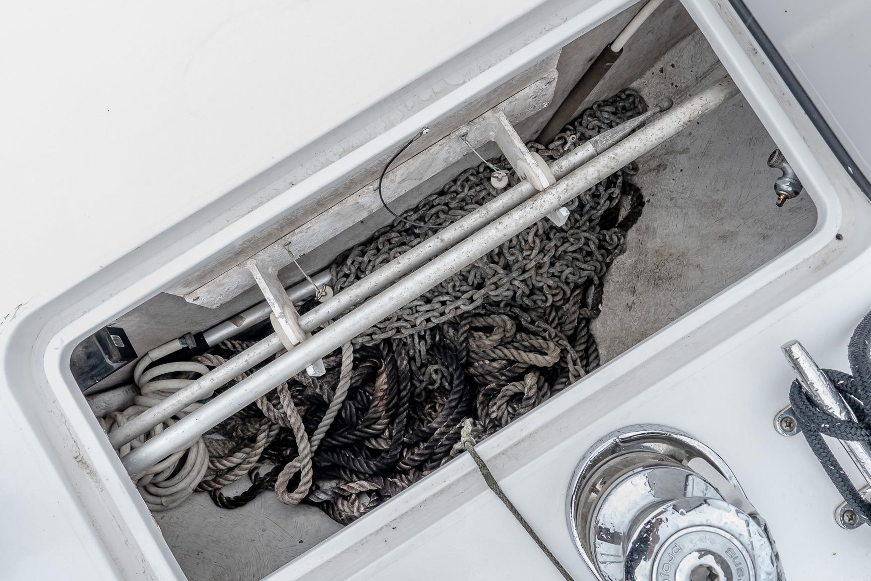 Storage compartment with ropes and chains on a 2000 Viking 50' Convertible boat.