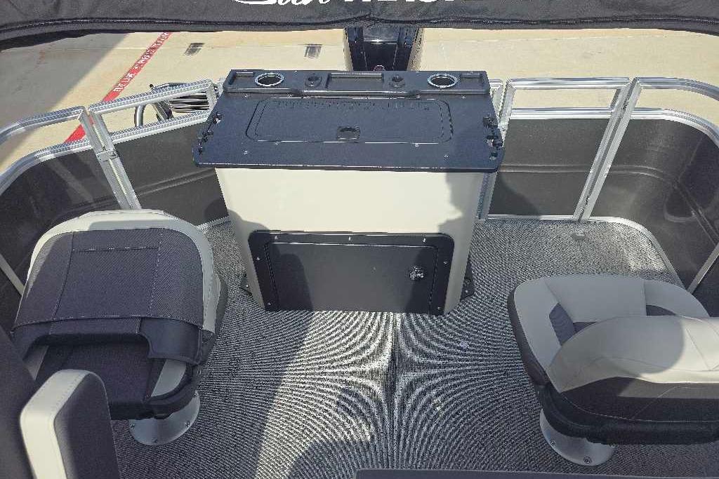 2026 Sun Tracker Fishin' Barge 20 DLX interior with seating and console.