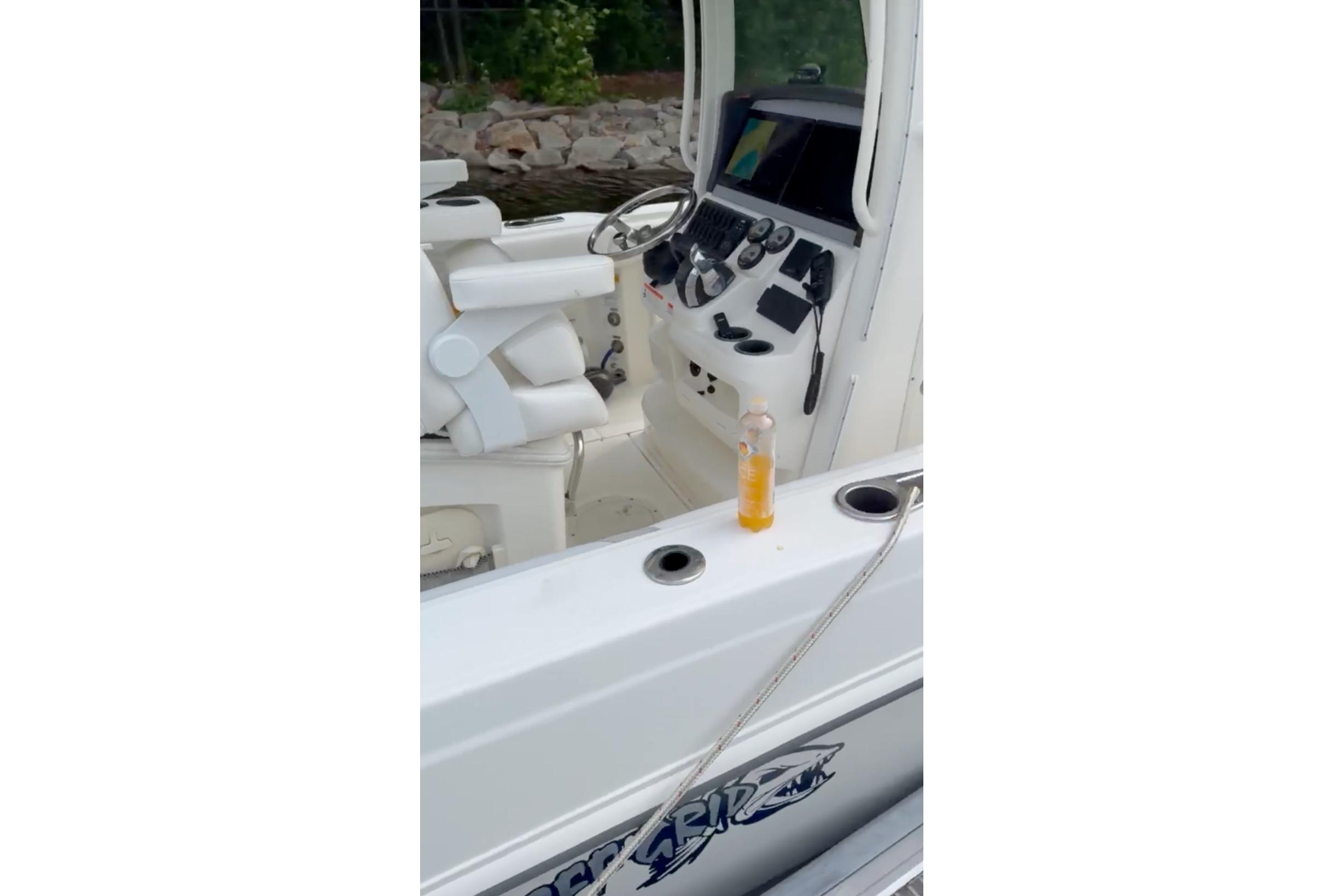 2023 Boston Whaler 250 Outrage boat interior with steering console and seating.