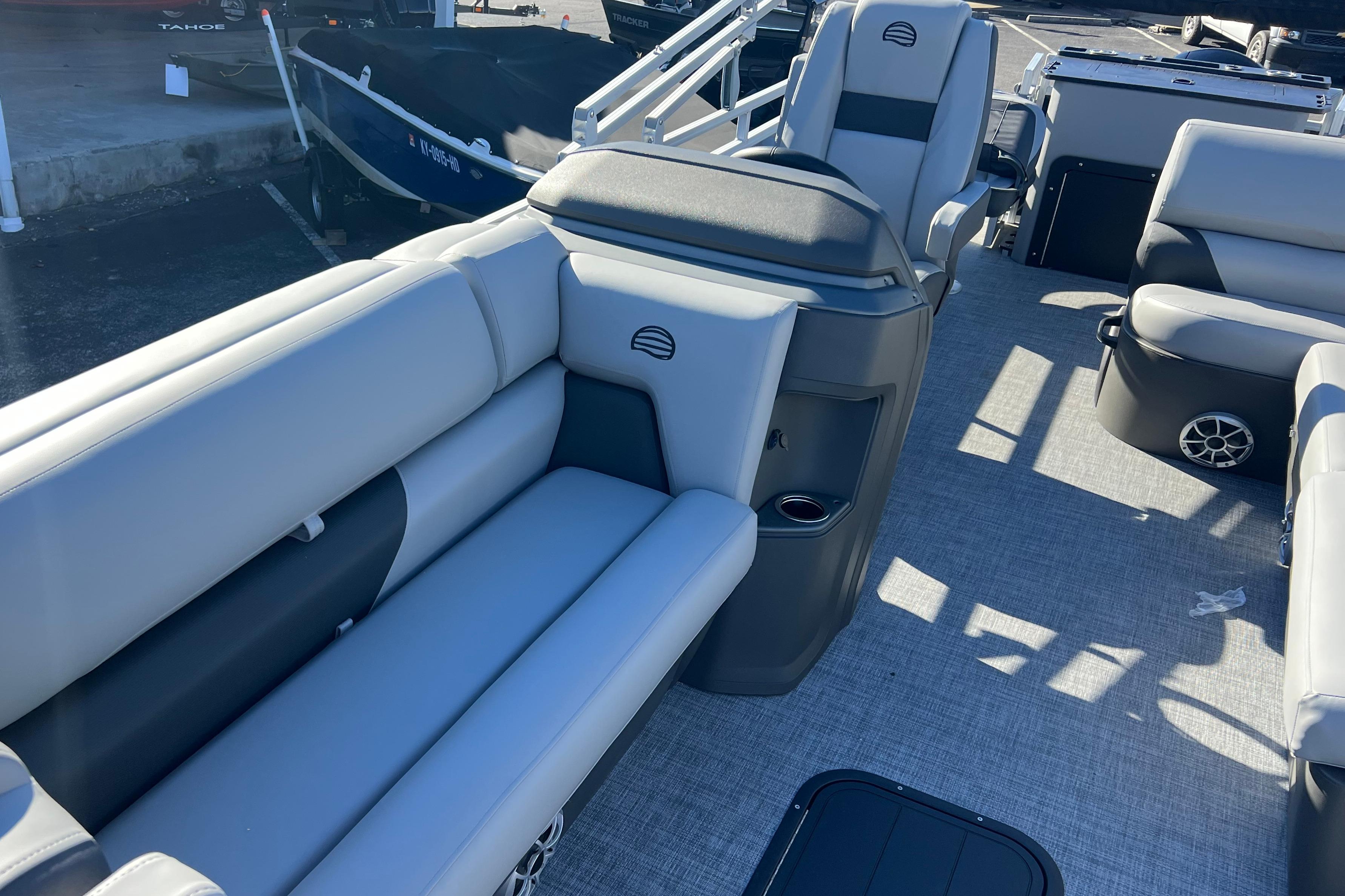 2026 Sun Tracker Sportfish 24 XP3 pontoon boat interior with gray seating and flooring.
