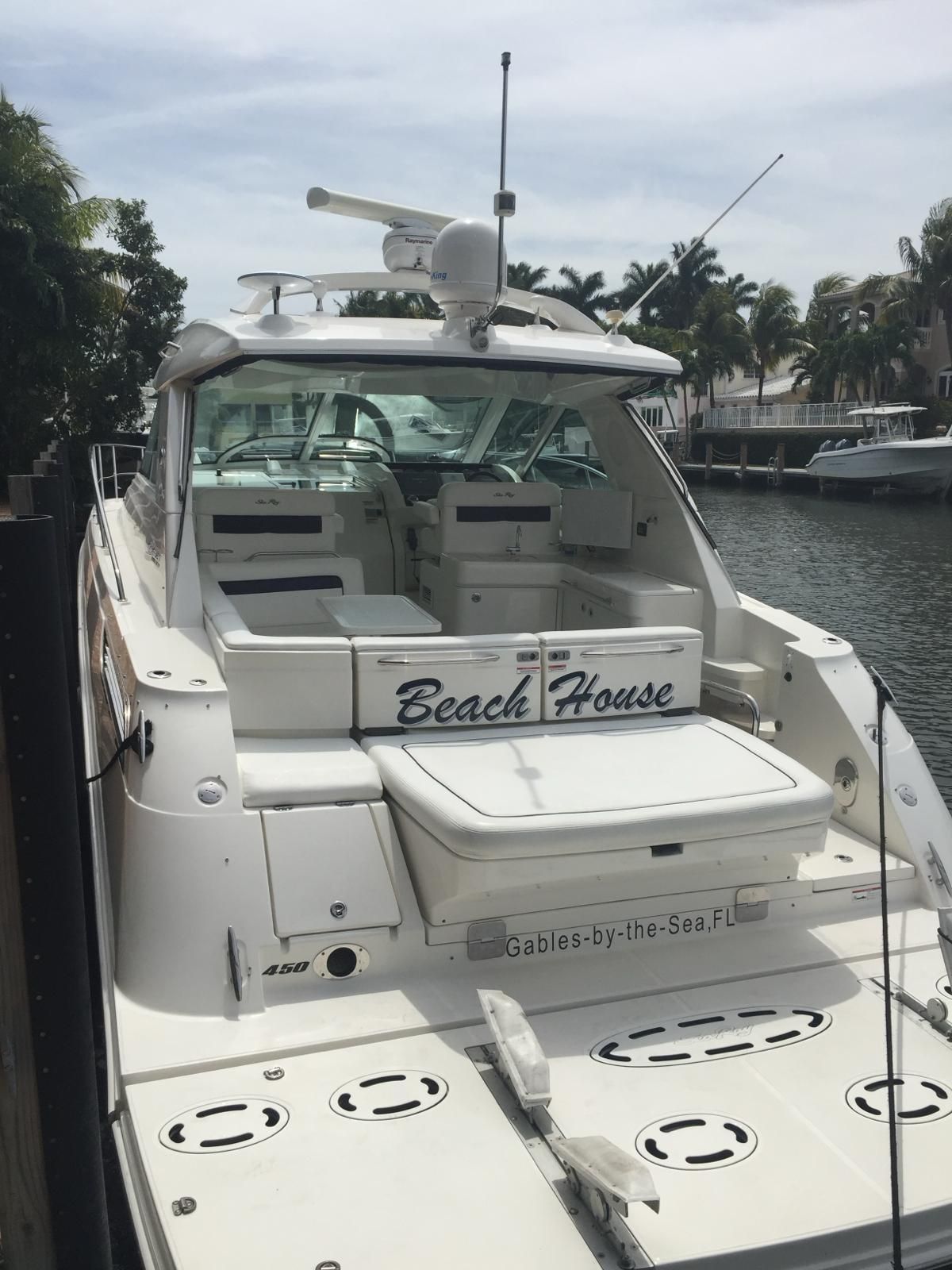 2010 Sea Ray 450 yacht docked, named "Beach House".