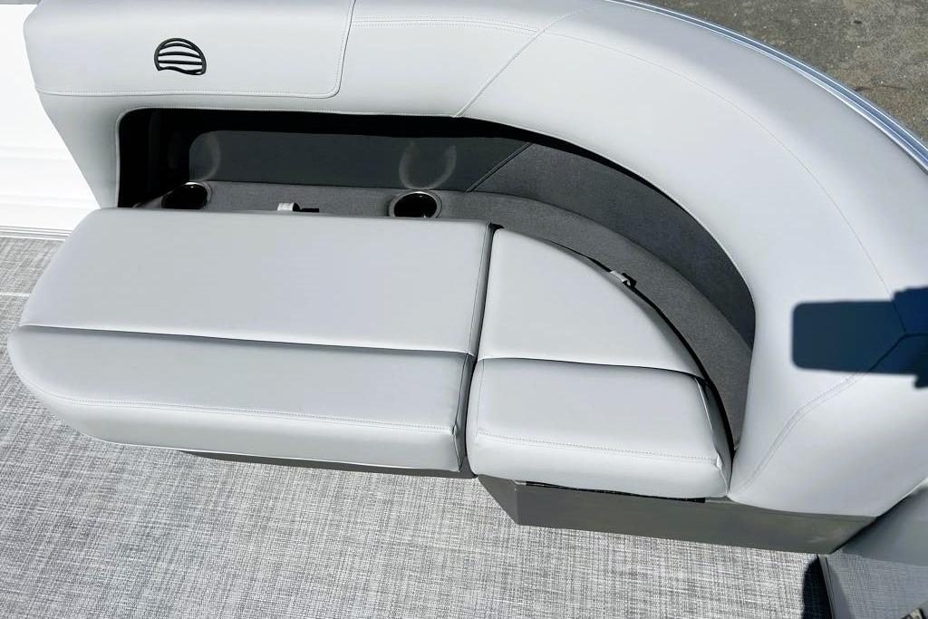 2026 Sun Tracker Party Barge 16 DLX seating with cup holders and sleek design.