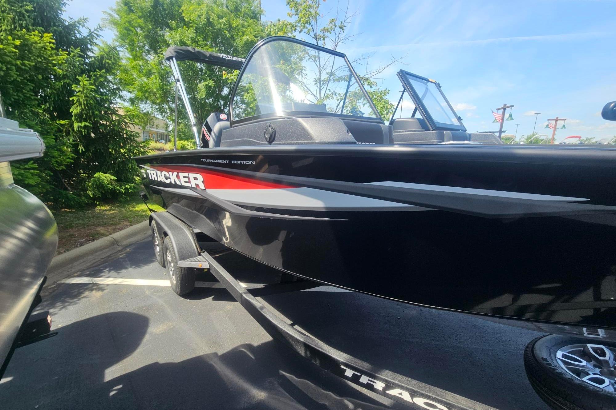 2026 Tracker Targa V-19 Combo boat parked outdoors, featuring sleek black design.