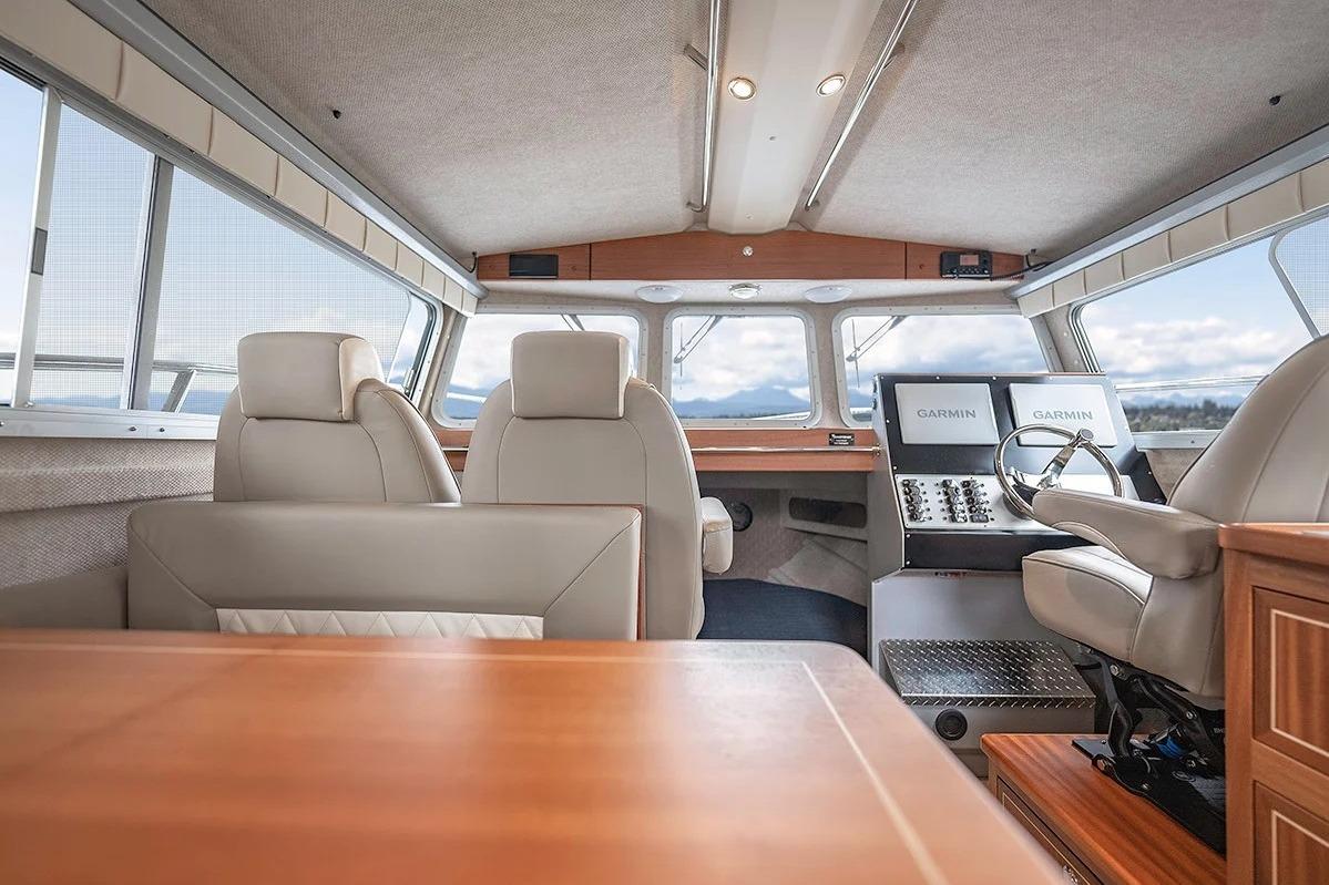 Interior of 2026 KingFisher 3225 GFX Offshore boat with modern seating and navigation equipment.