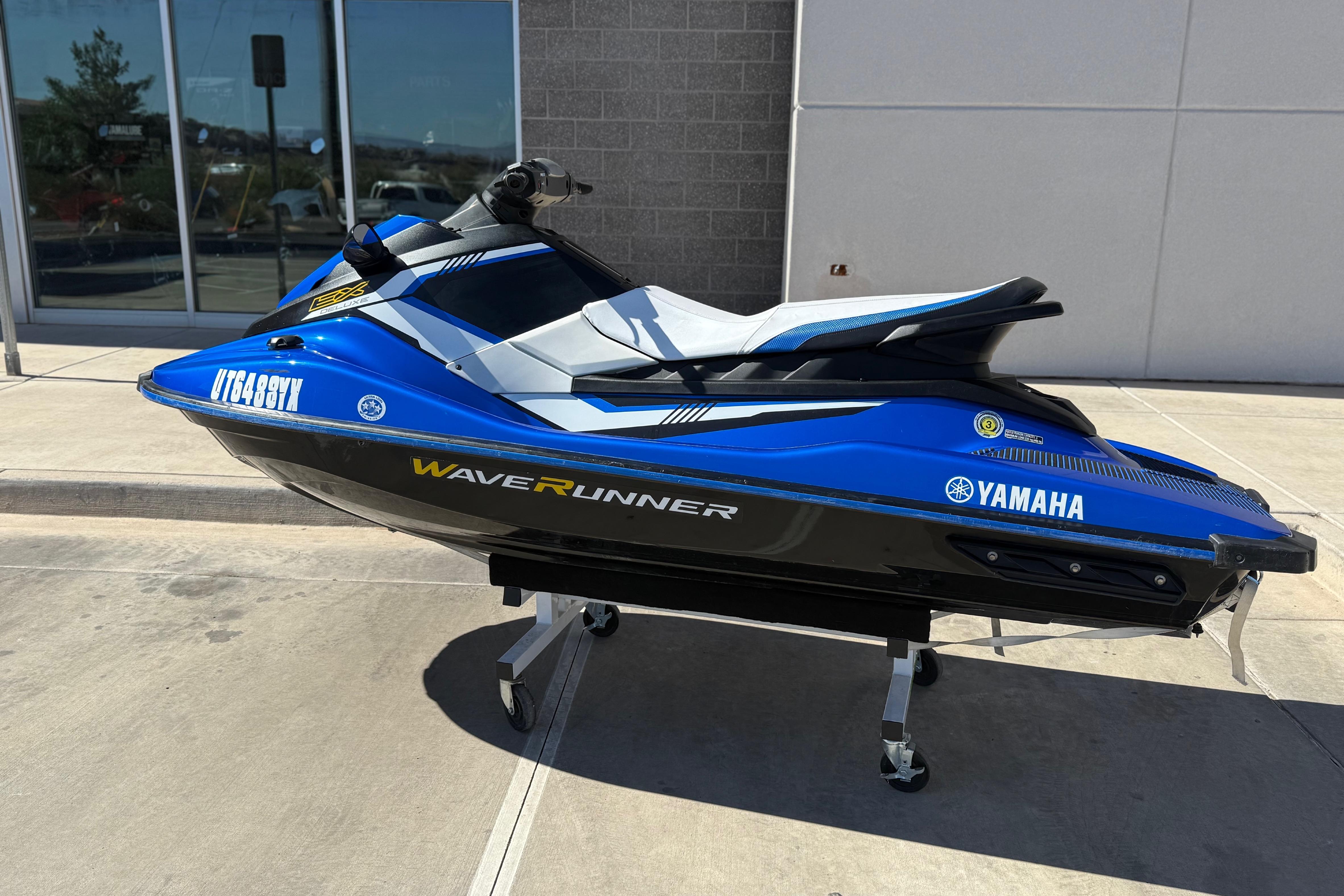 2017 Yamaha WaveRunner EX Deluxe in blue, parked outdoors on a sunny day.