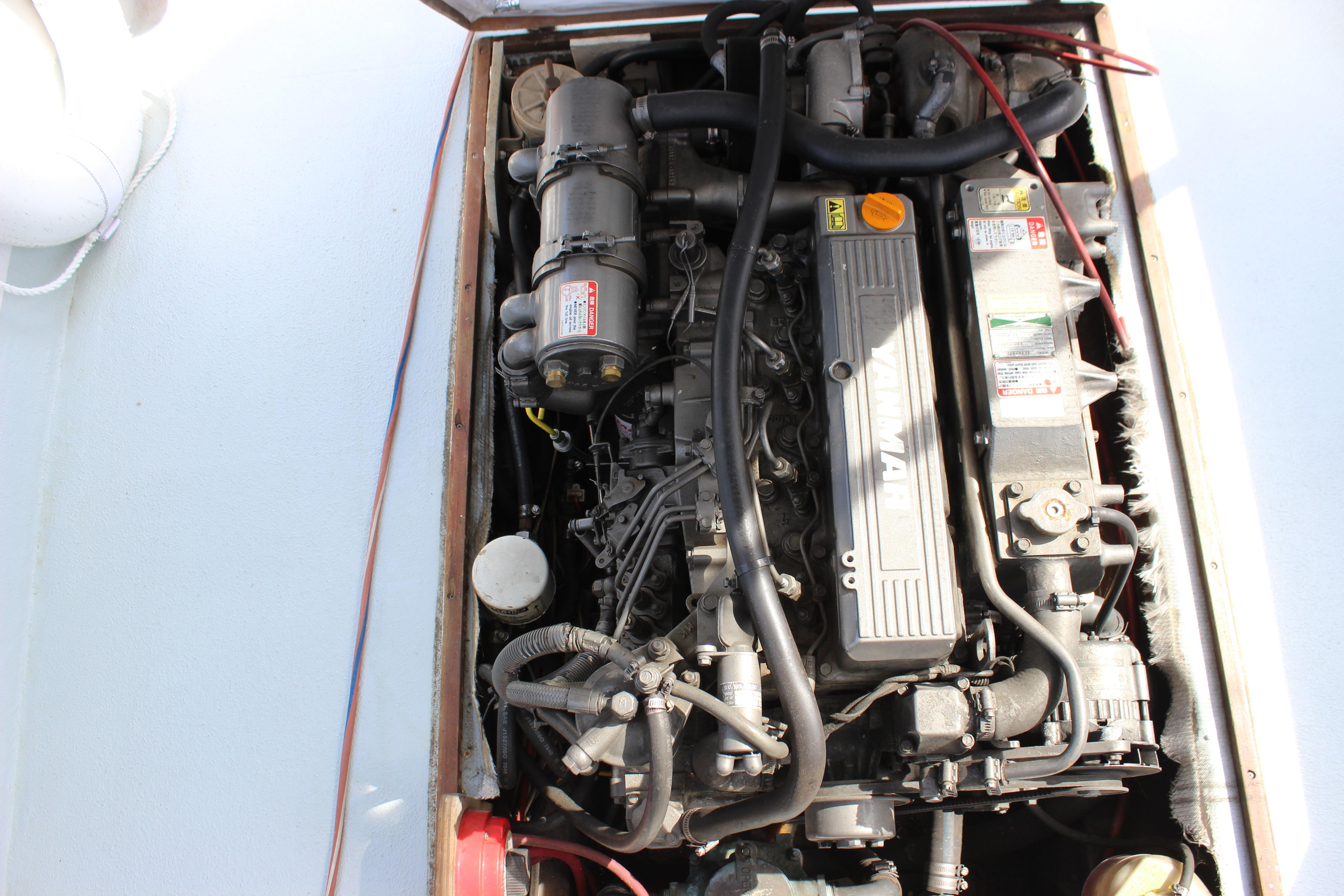 Engine compartment of a 1979 Tripp Angler 22 Flush Deck Cuddy boat.