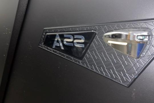 Close-up of Alera A22Q 2026 model emblem on textured surface.