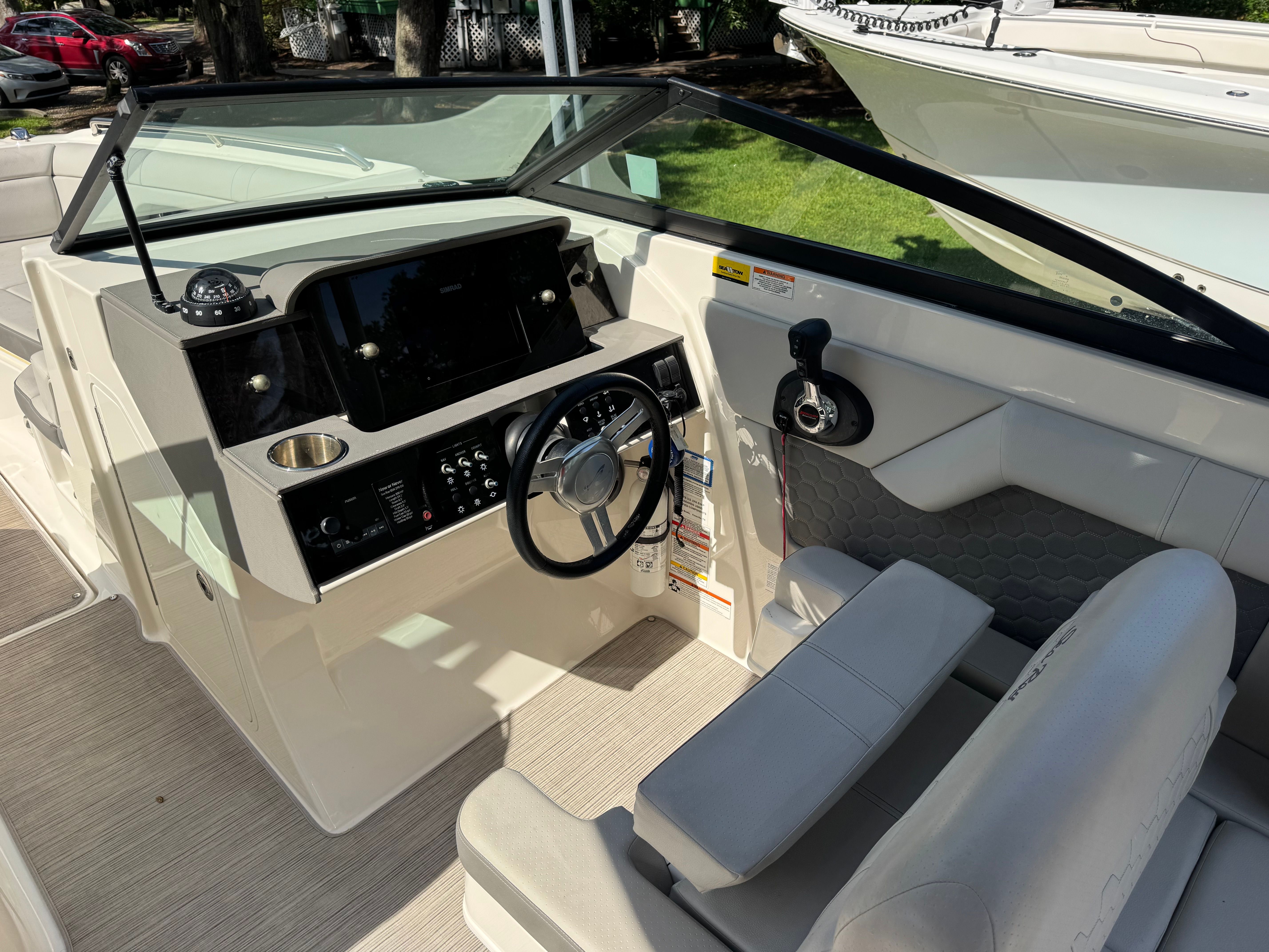 Interior of 2020 Sea Ray SDX 270 Outboard with helm console.