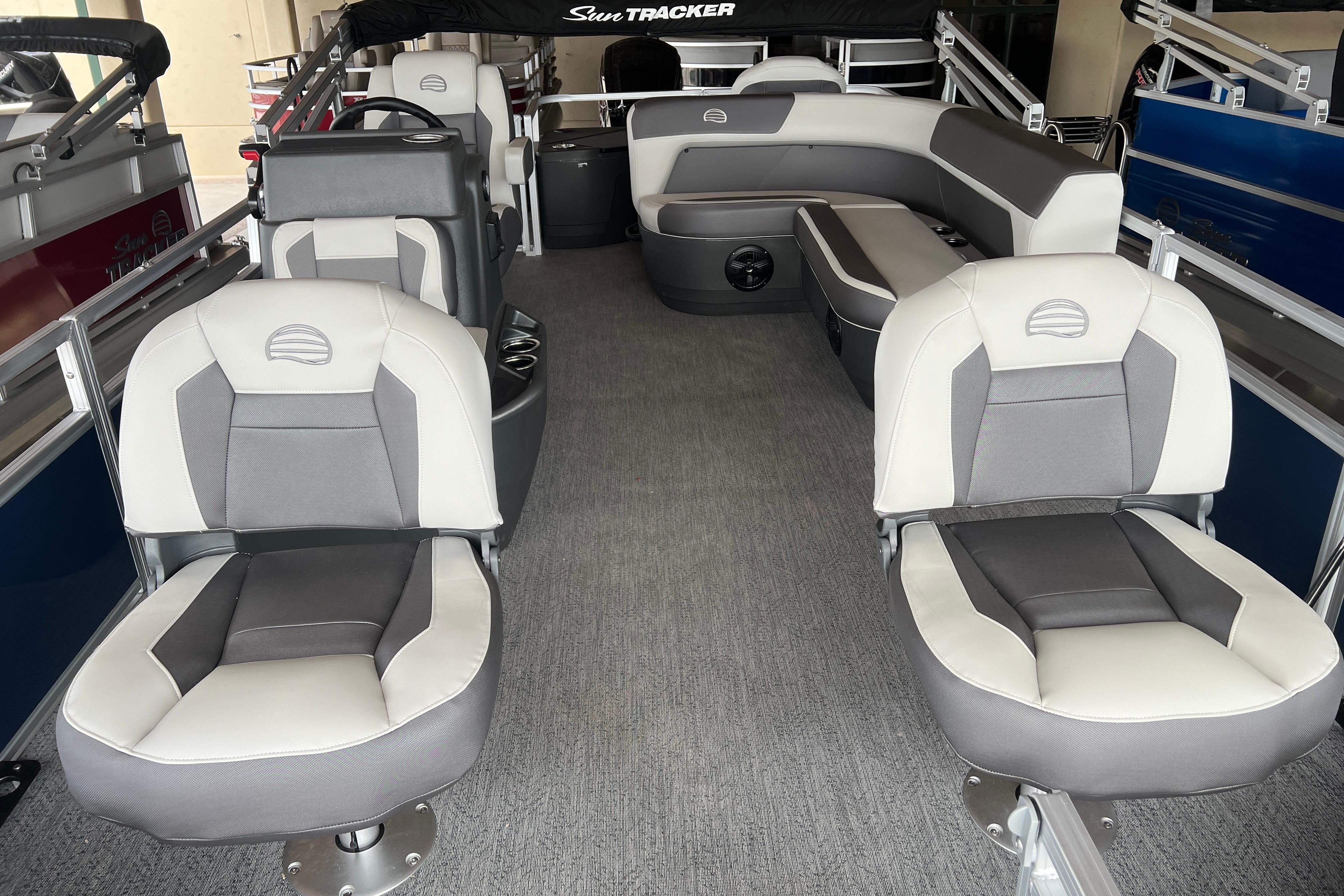 2026 Sun Tracker Bass Buggy 18 DLX interior with gray and white seating.