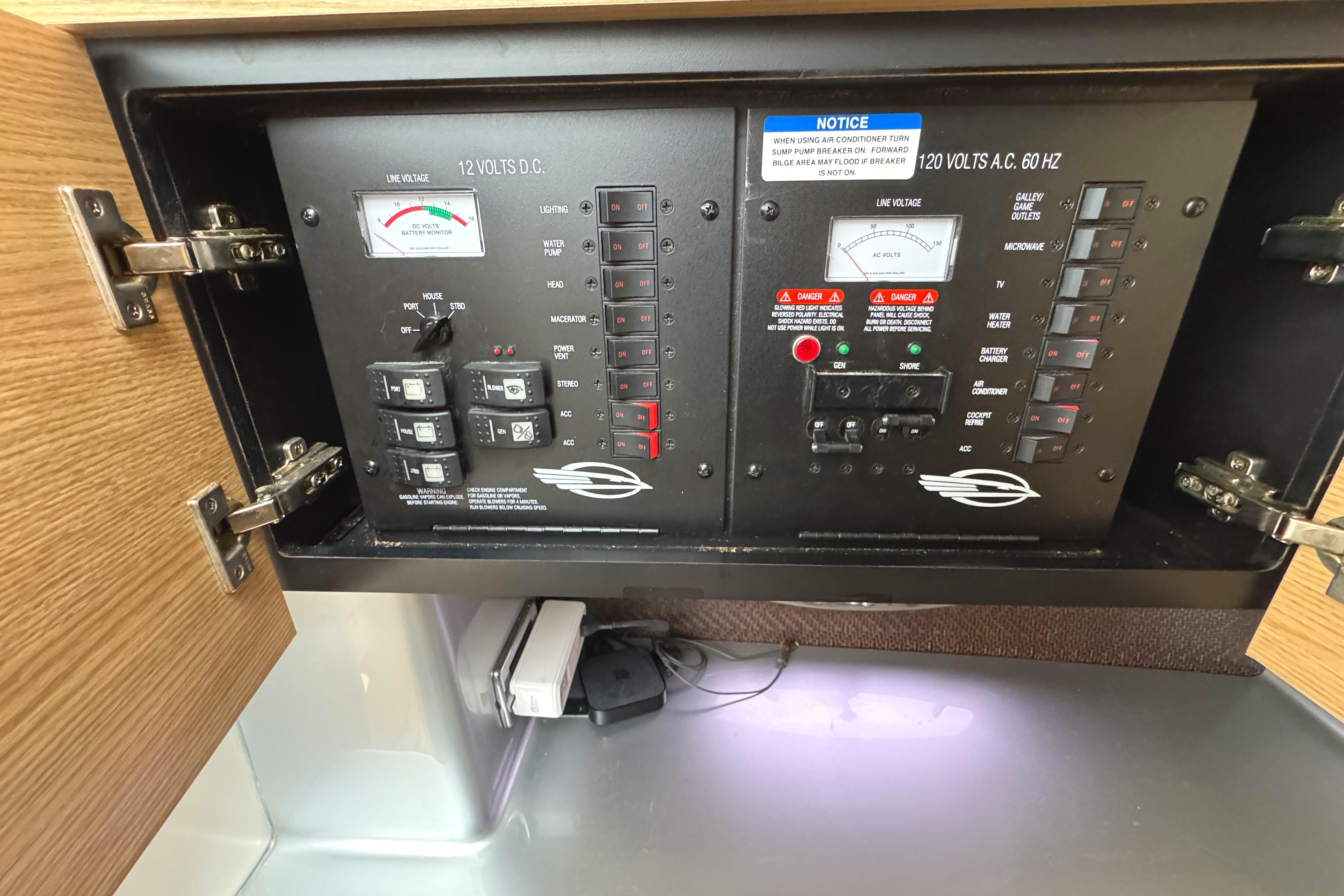 Electrical control panel inside 2012 Chaparral 327 SSX boat, featuring switches and meters.