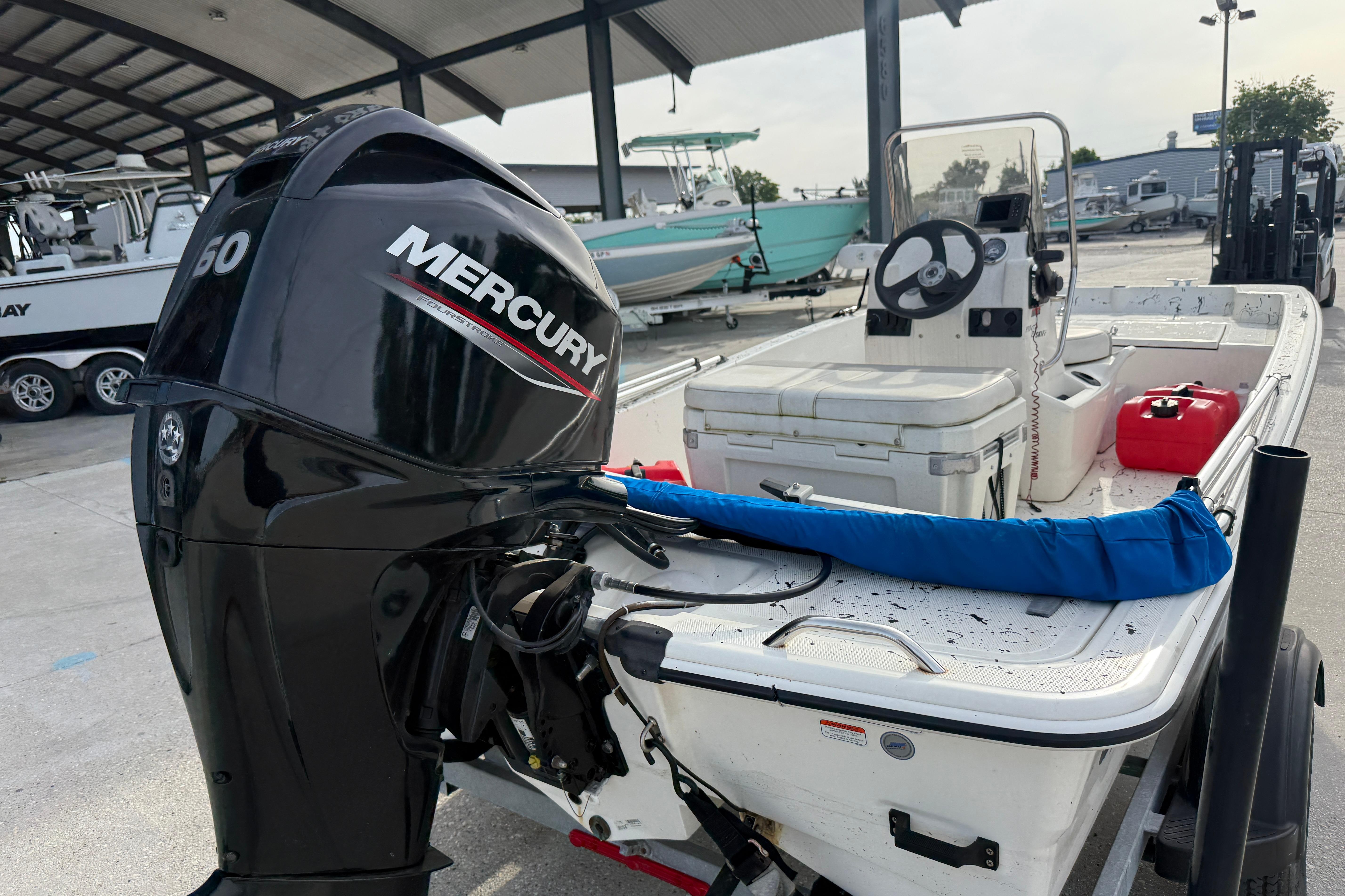 2020 Mako Pro Skiff 15 CC with Mercury 50 engine at a marina.