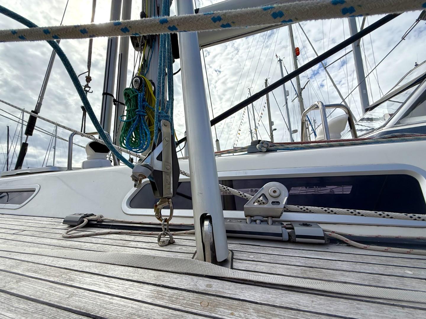Deck view of a 2002 Najad 490 sailboat, showcasing rigging and fittings.