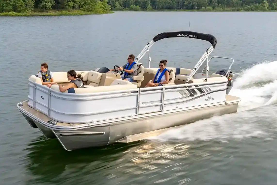 Manufacturer Provided Image: 2026 SunCatcher Select 322RC pontoon boat cruising on a lake with passengers.