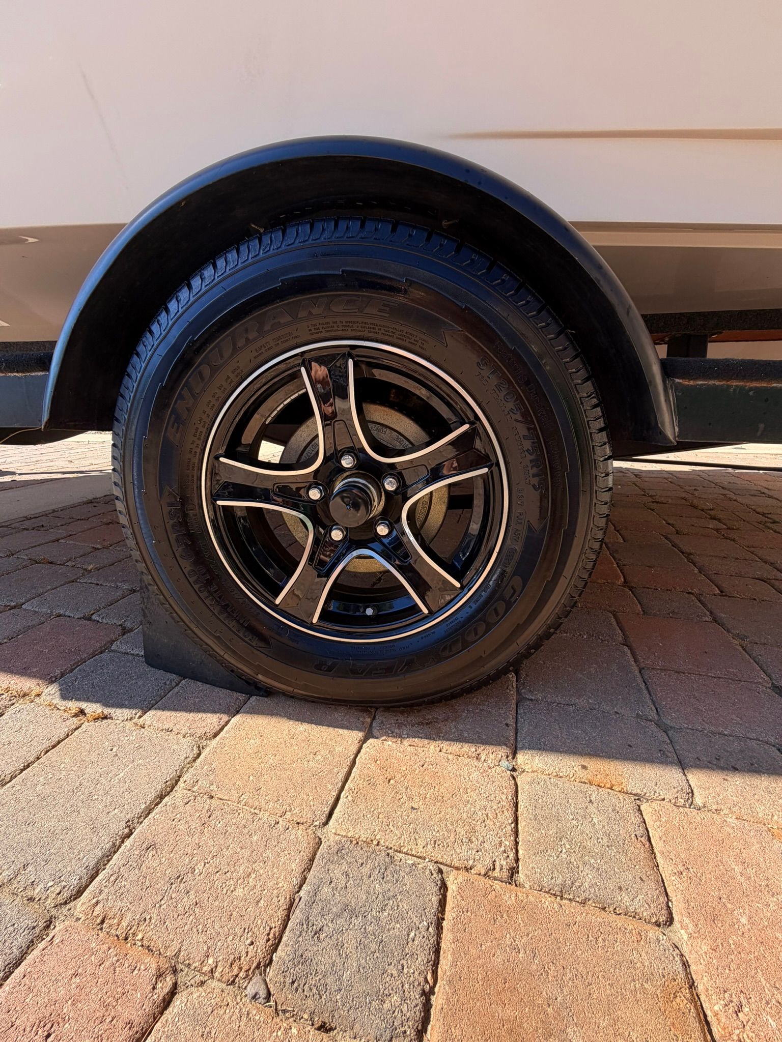 Close-up of a 1996 Correct Craft Tournament trailer wheel.