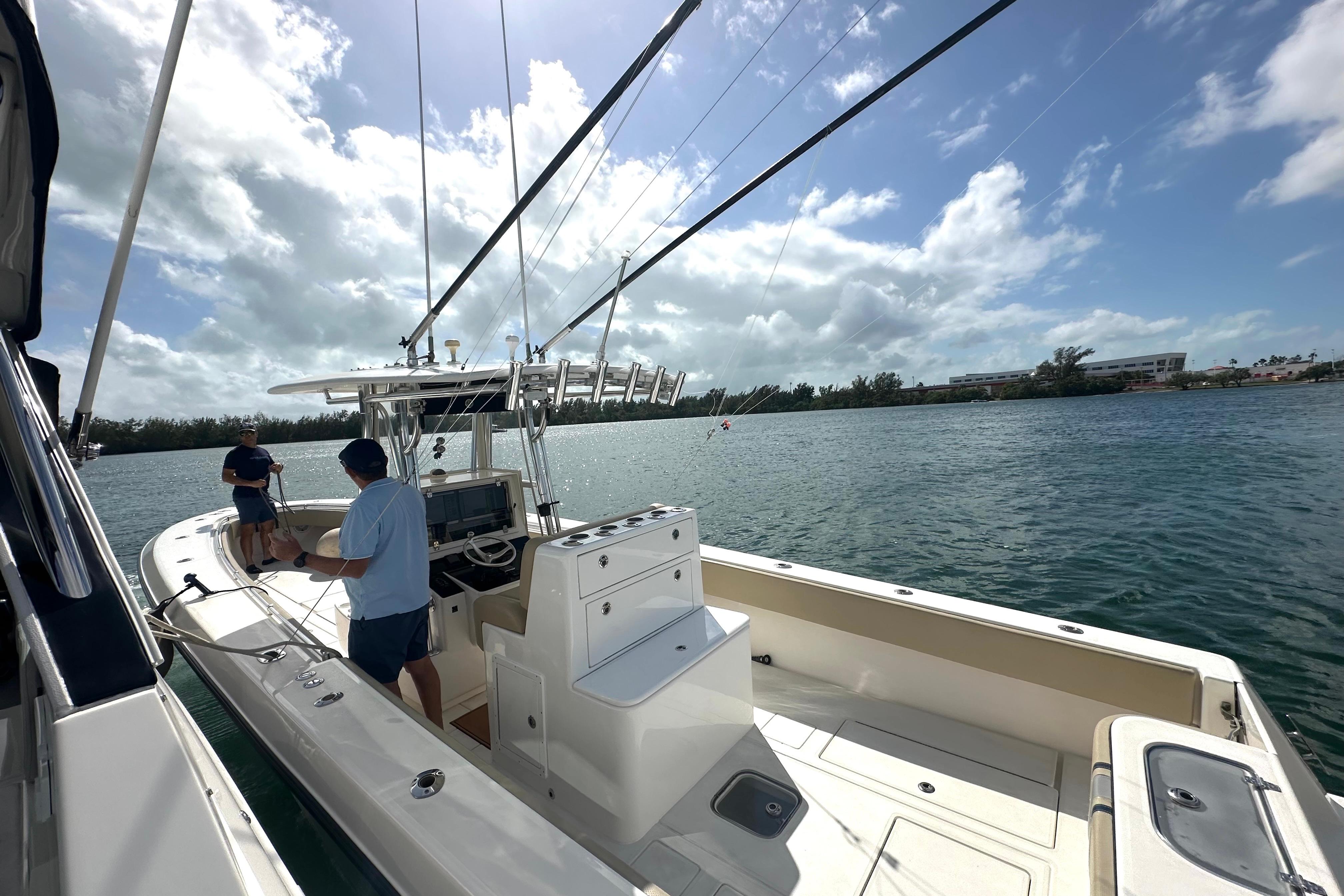 2008 Contender 36 Open boat on water with two people, clear sky, and scenic view.