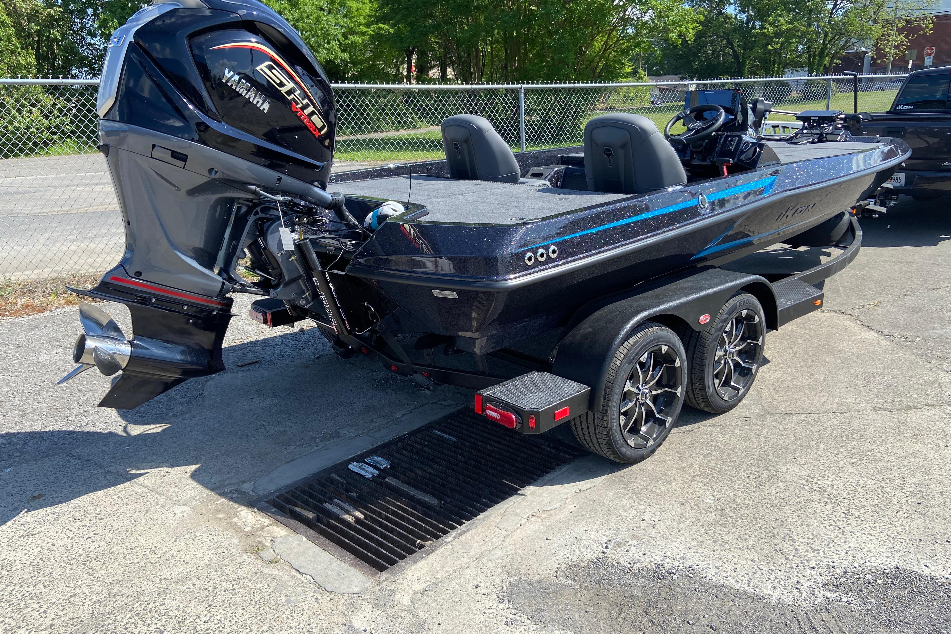 2026 iKon VLX 21 boat with Yamaha engine on a trailer, parked outdoors.