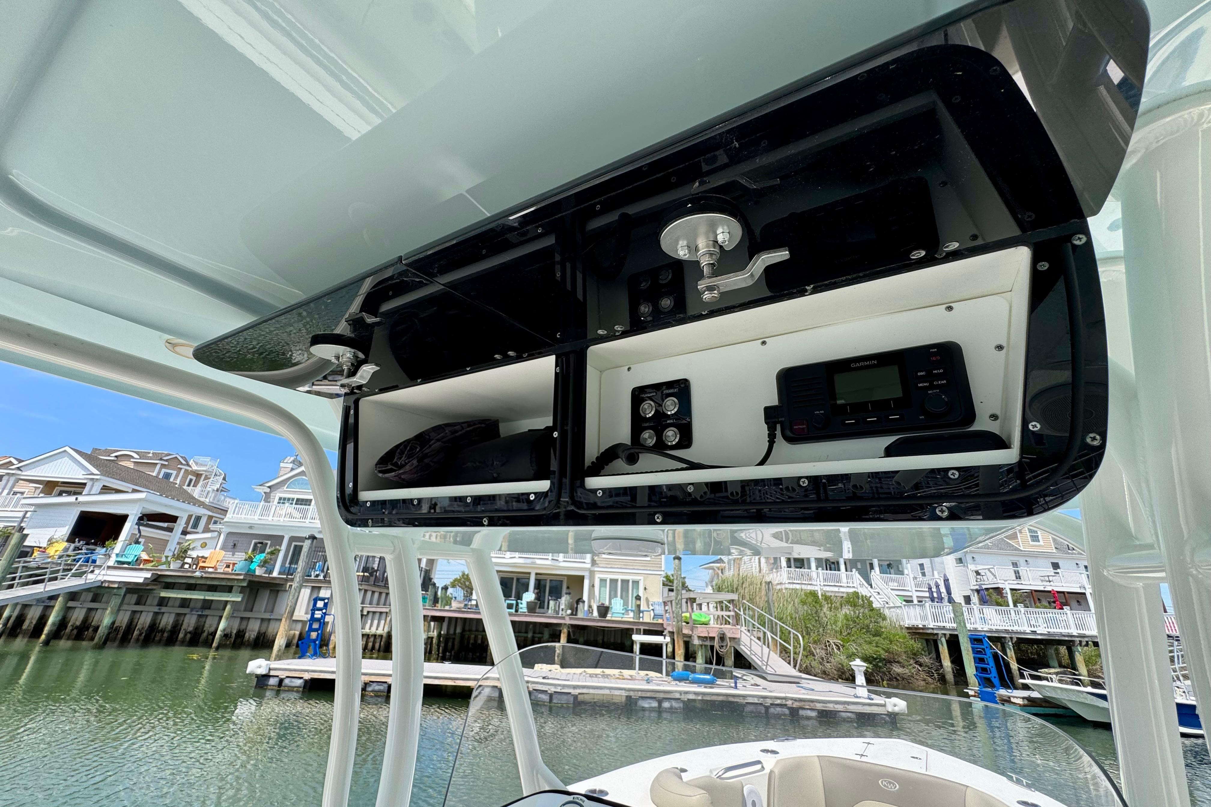 2022 Key West 263 FS boat console with electronic controls and storage compartments.
