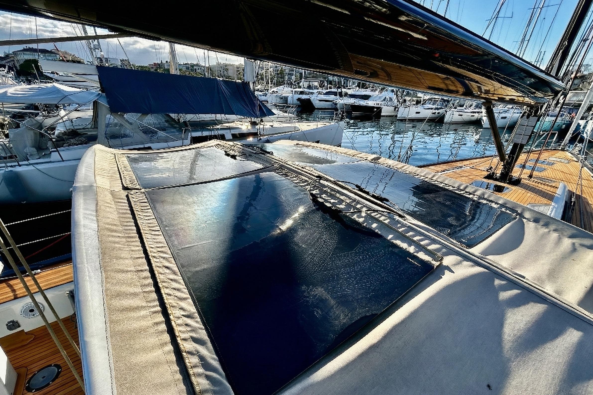 2022 Solaris 55 yacht with sleek deck design, docked in a marina.