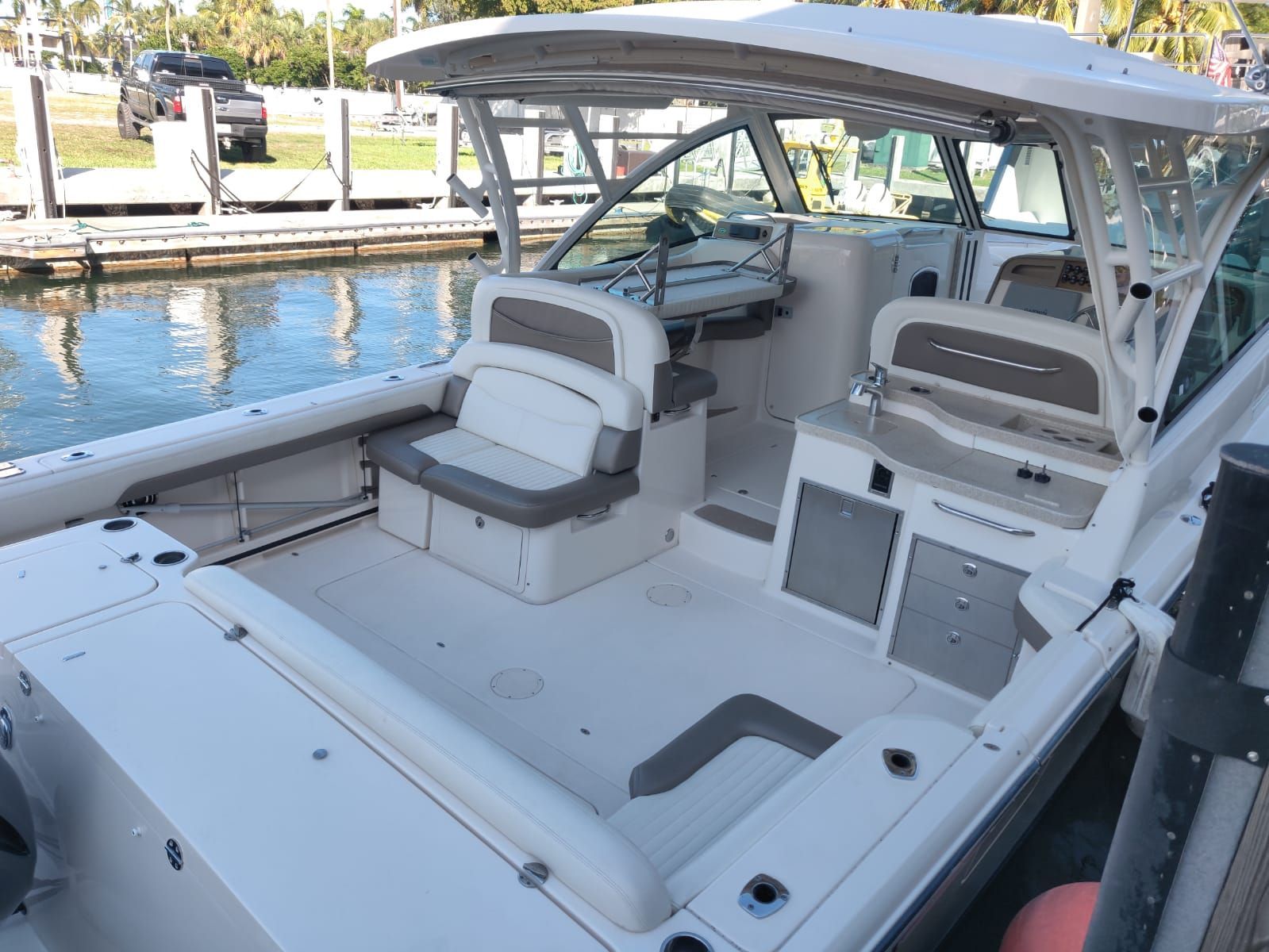 A 2014 Grady-White Freedom 375 boat docked. It features a spacious, well-equipped cabin.