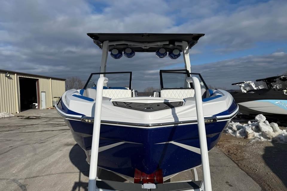 2026 Tigé Z3 boat with sleek design, parked outdoors under cloudy sky.