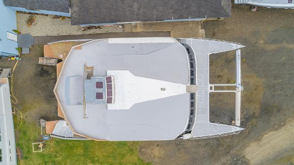 Aerial view of 2025 Catamaran Bloomfield 86 Motorsailor docked on land.