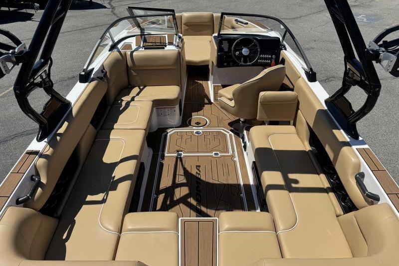 2023 Moomba Mojo Pro boat interior with tan seating and sleek dashboard design.