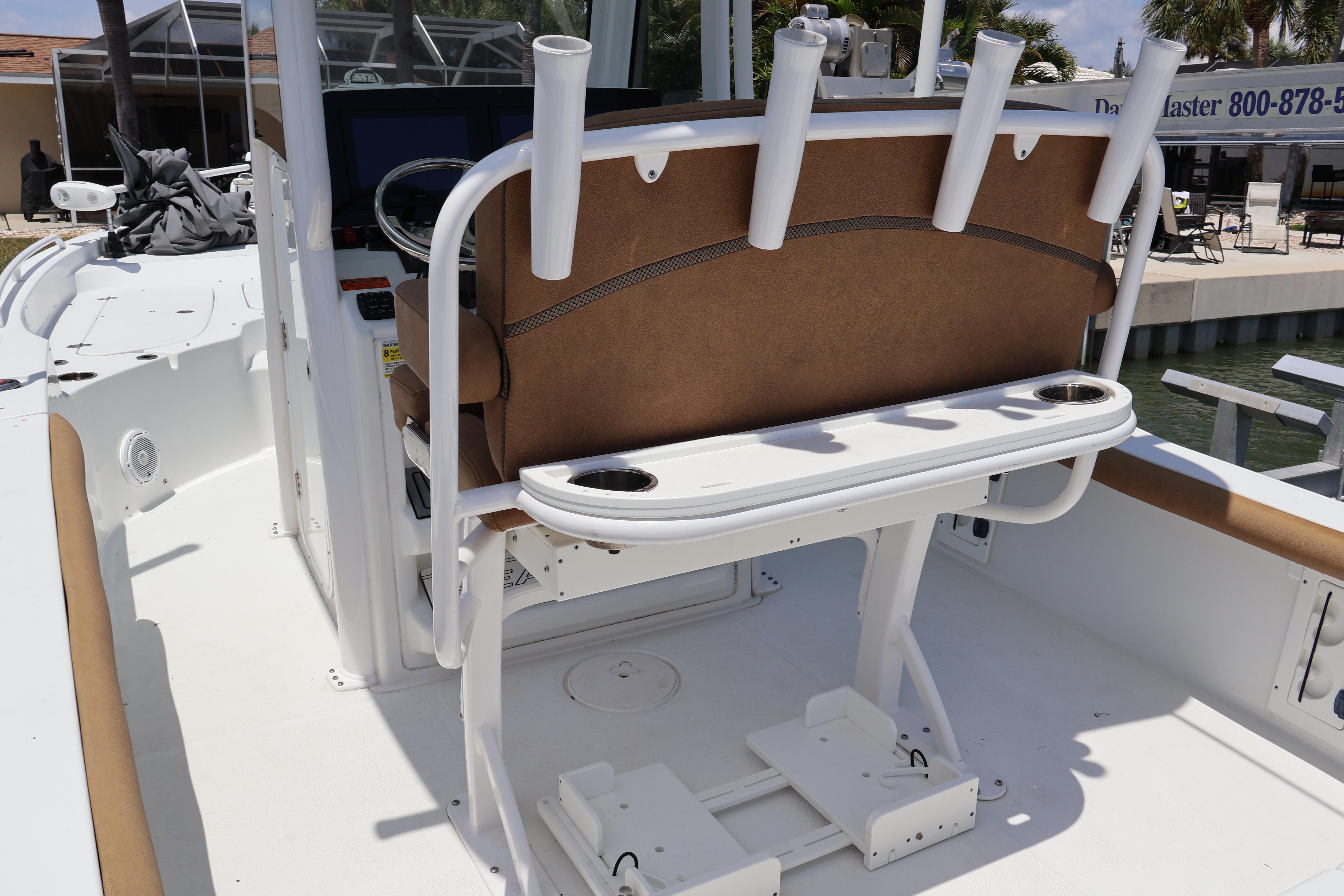 2022 Sea Hunt BX 25 FS boat interior with rod holders and seating.