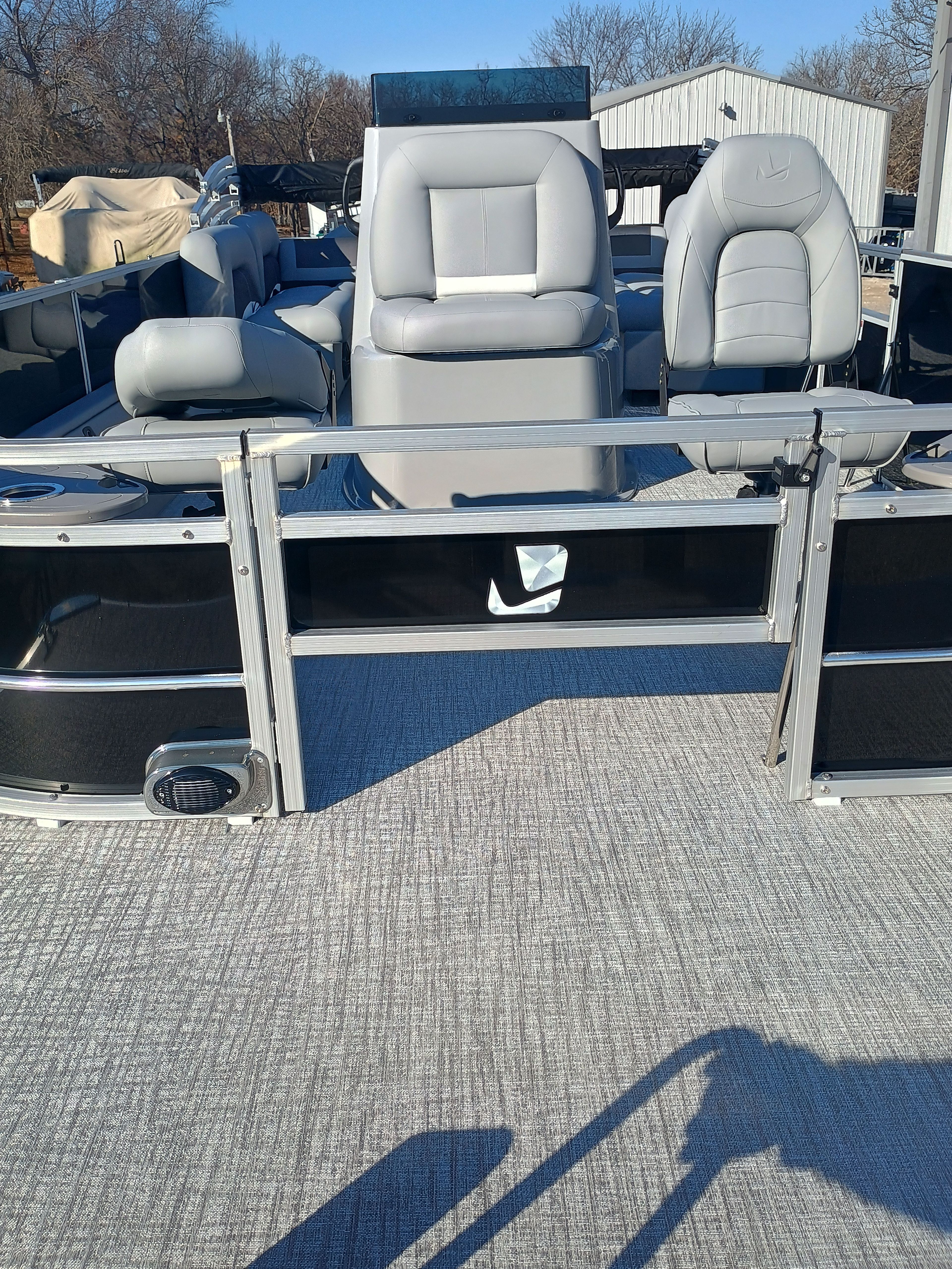 2026 Landau Alure 25CC Fish-Black with gray seating on boat.