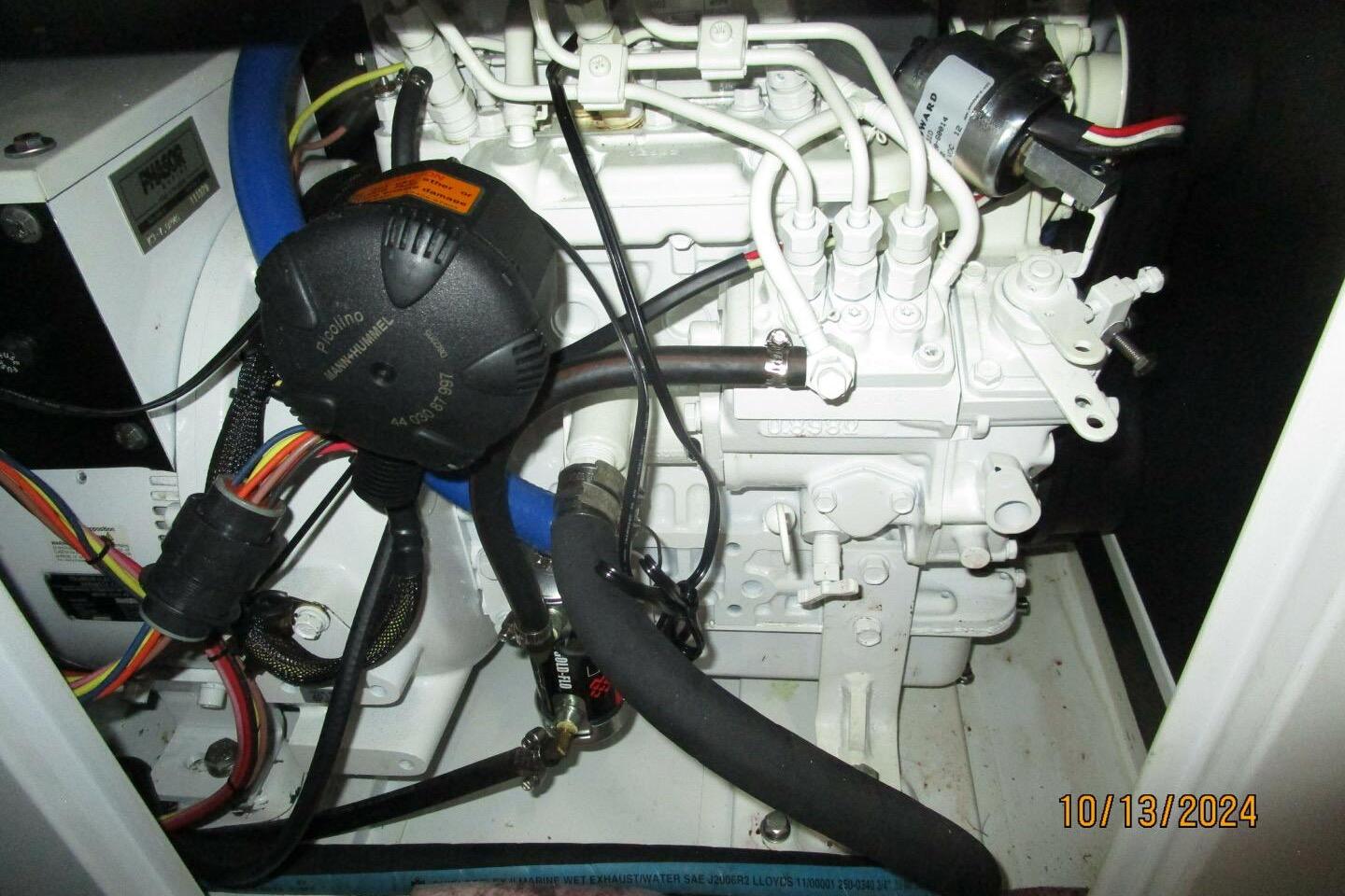 Engine compartment of a 1997 Rosborough Trawler, showcasing wiring and mechanical components.