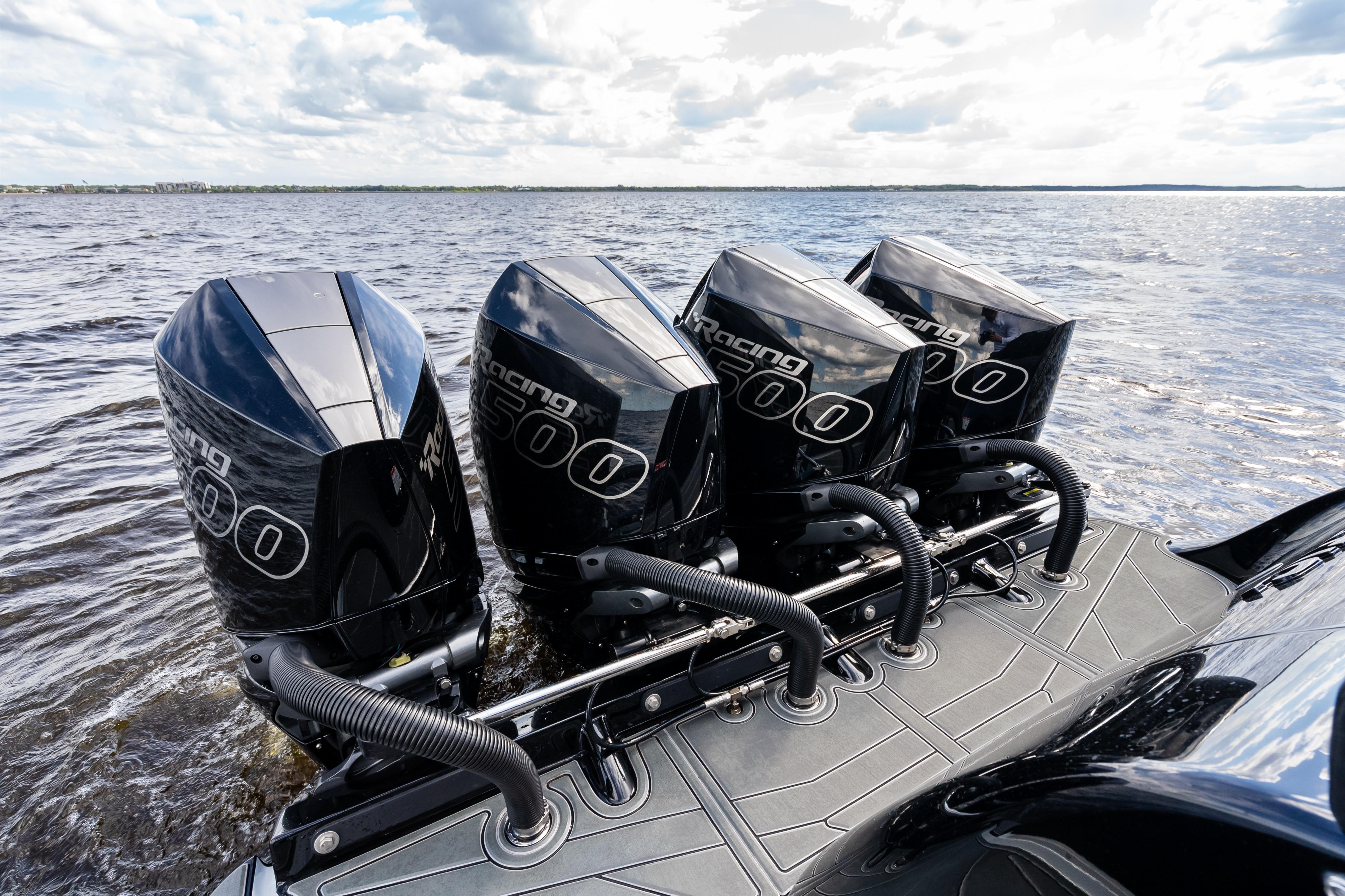 2027 Mystic Powerboats M4200 with four powerful outboard engines on open water.