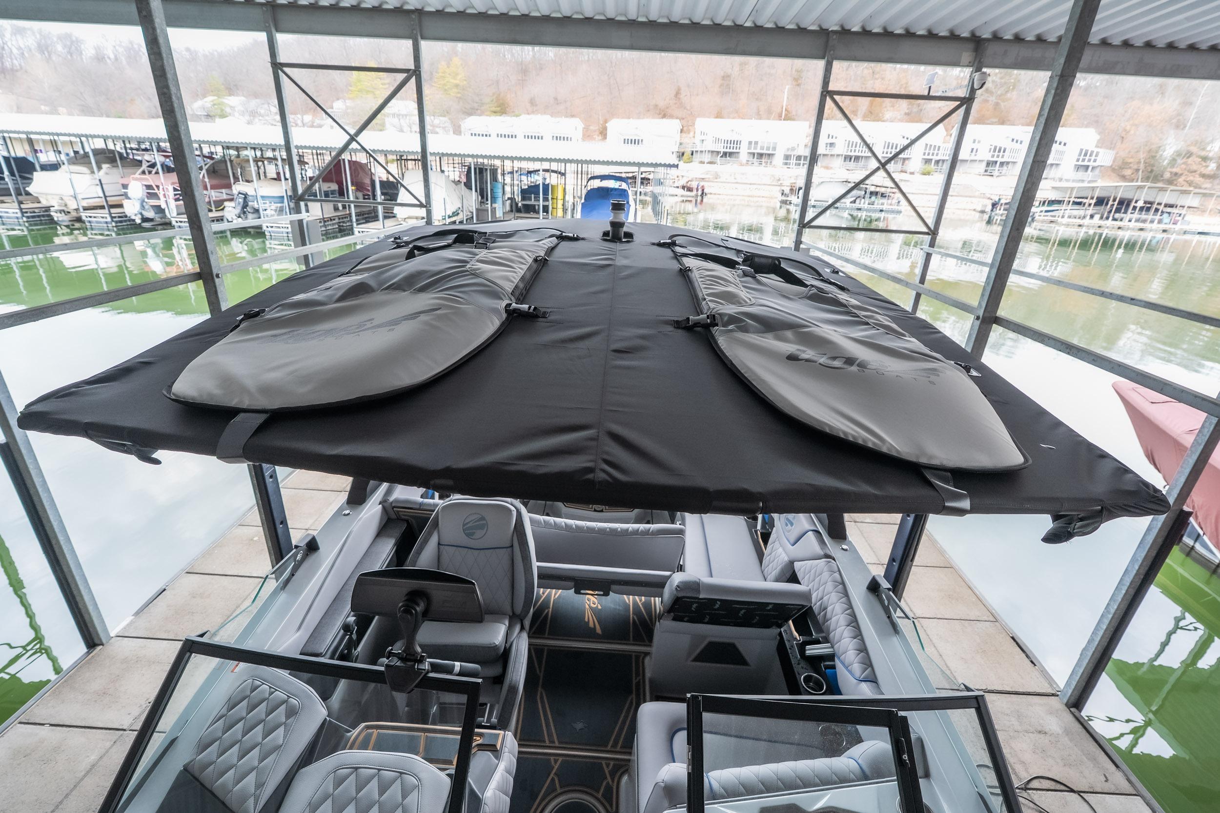 2026 Tigé Z3 boat with covered top, docked in a marina setting.