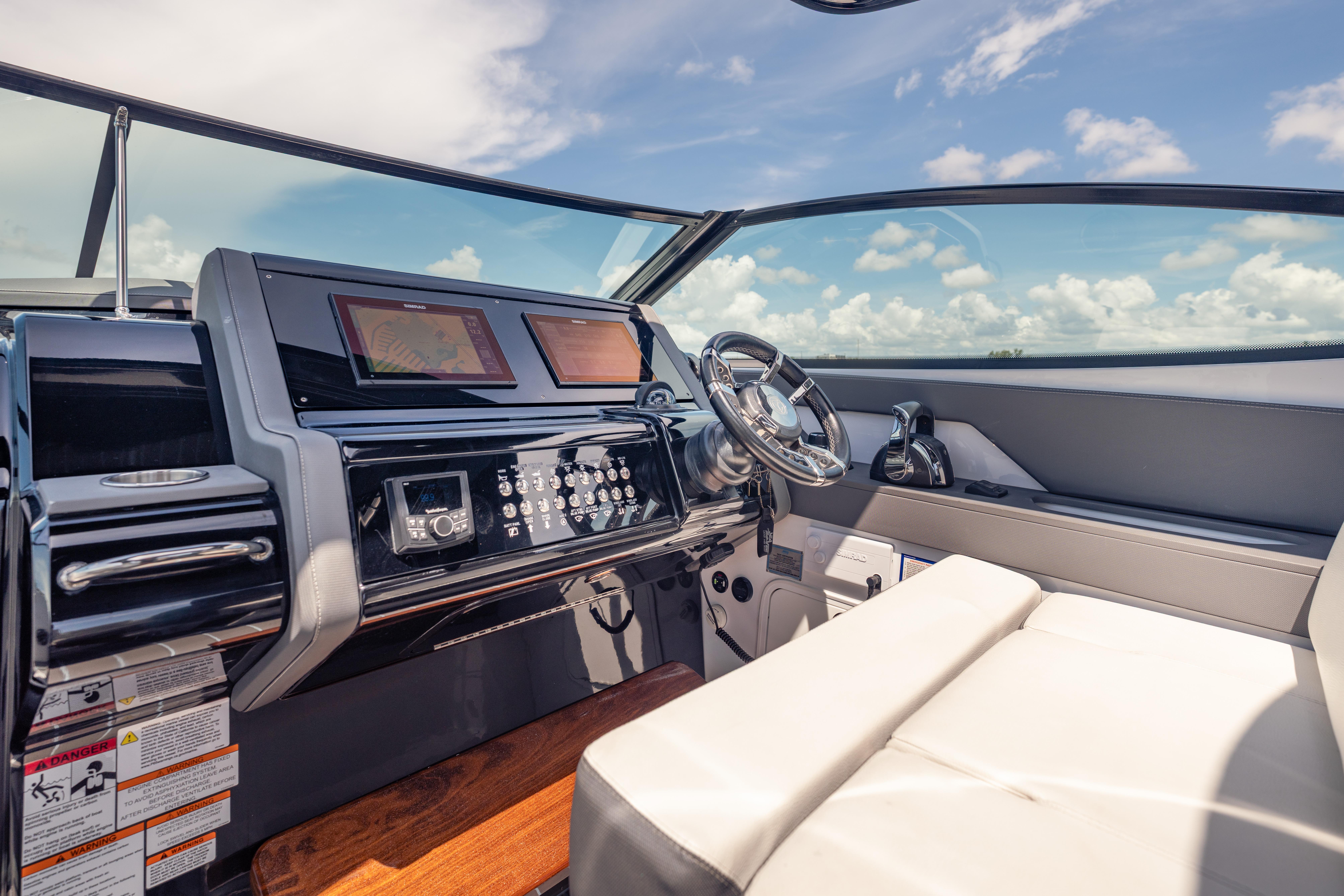 2021 Cruisers Yachts 38 GLS helm with modern controls and navigation screens.