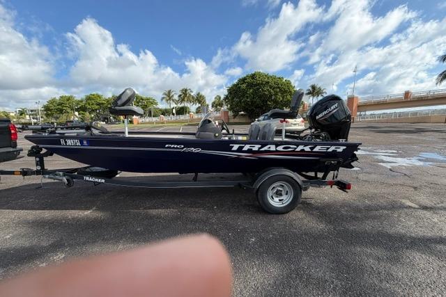 2020 Tracker Pro 170 boat on trailer, parked outdoors under a partly cloudy sky.