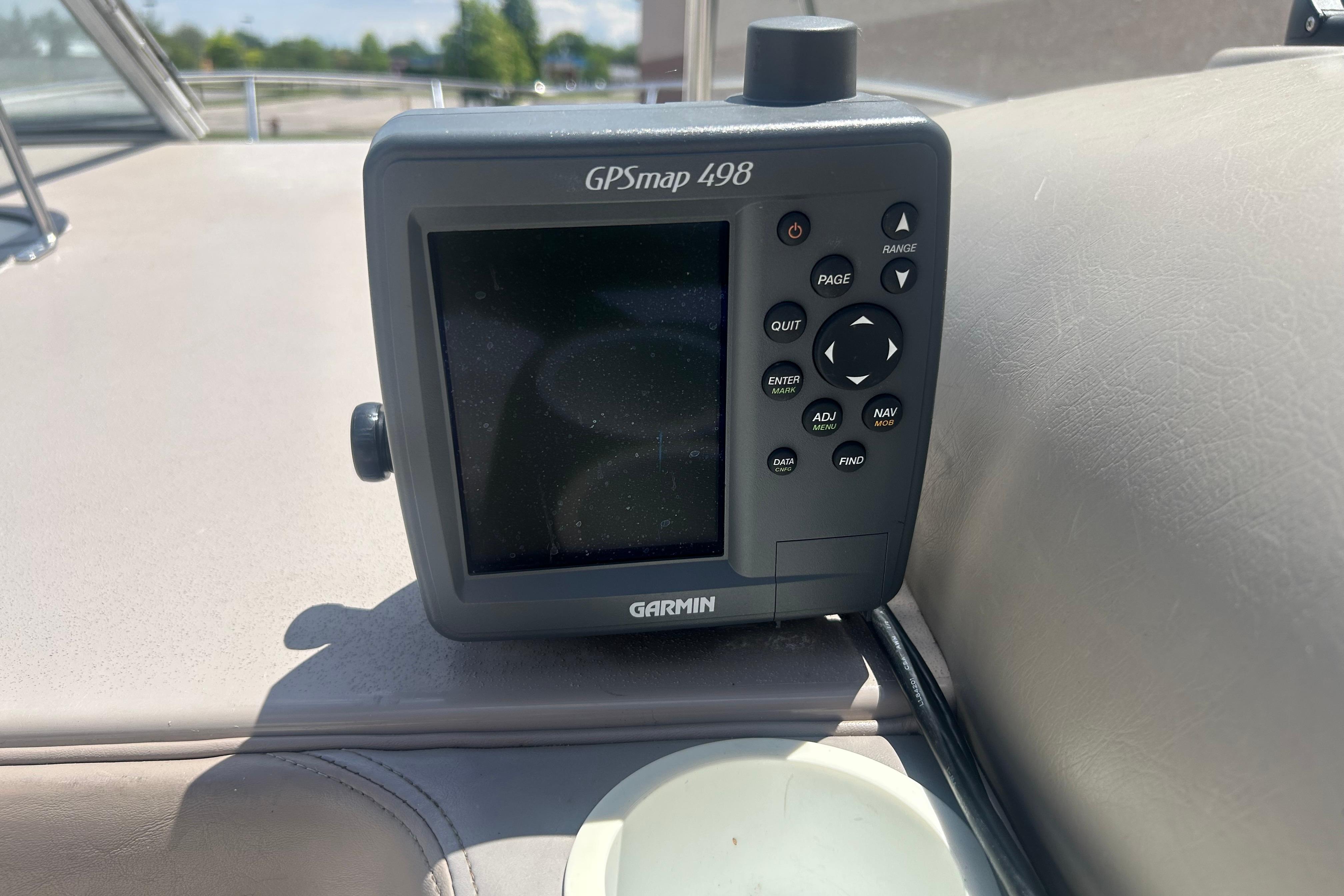 Garmin GPSmap 498 on 1998 Four Winns 258 Vista boat dashboard.