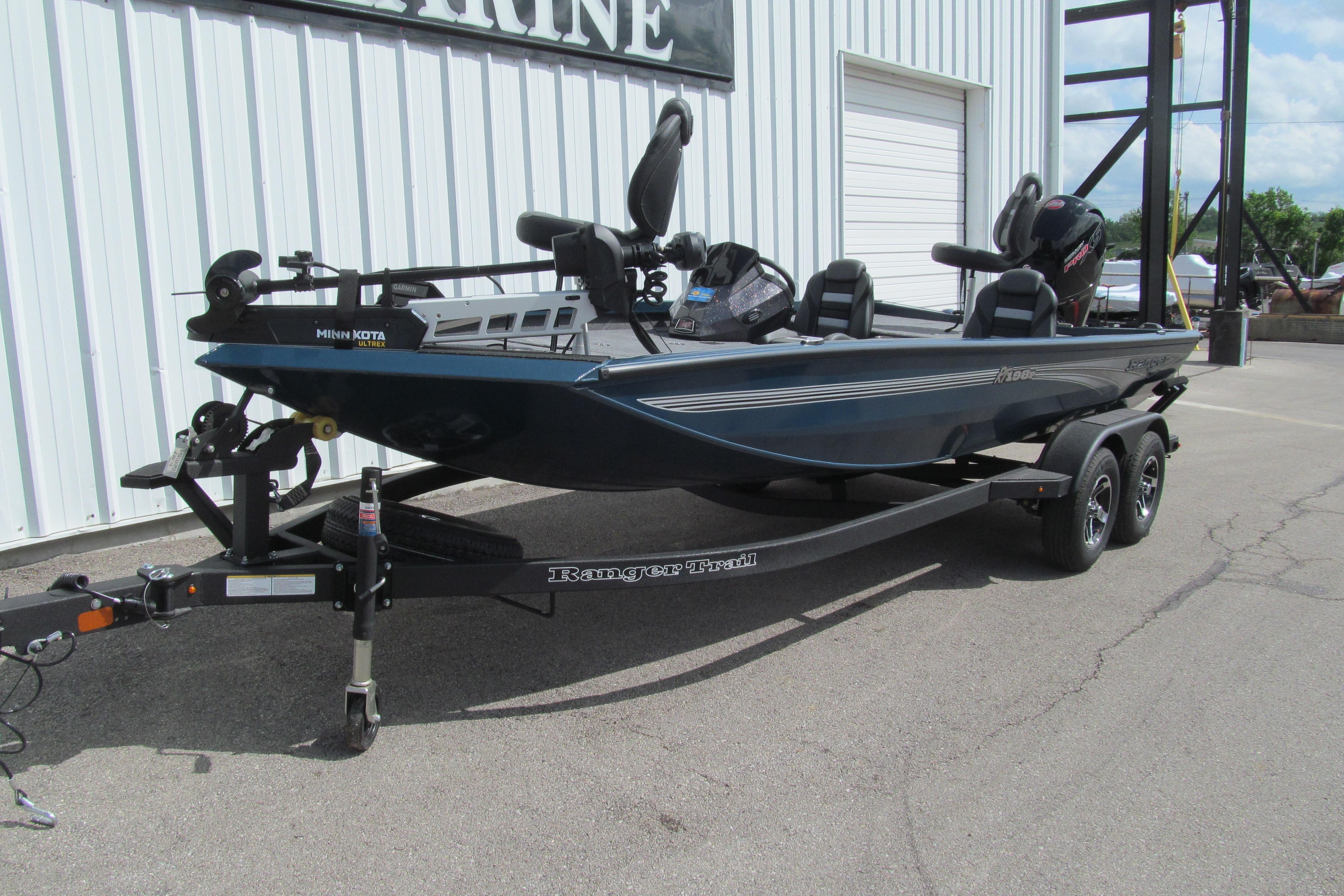 2026 Ranger RT198P fishing boat on trailer, parked outside a marine facility.