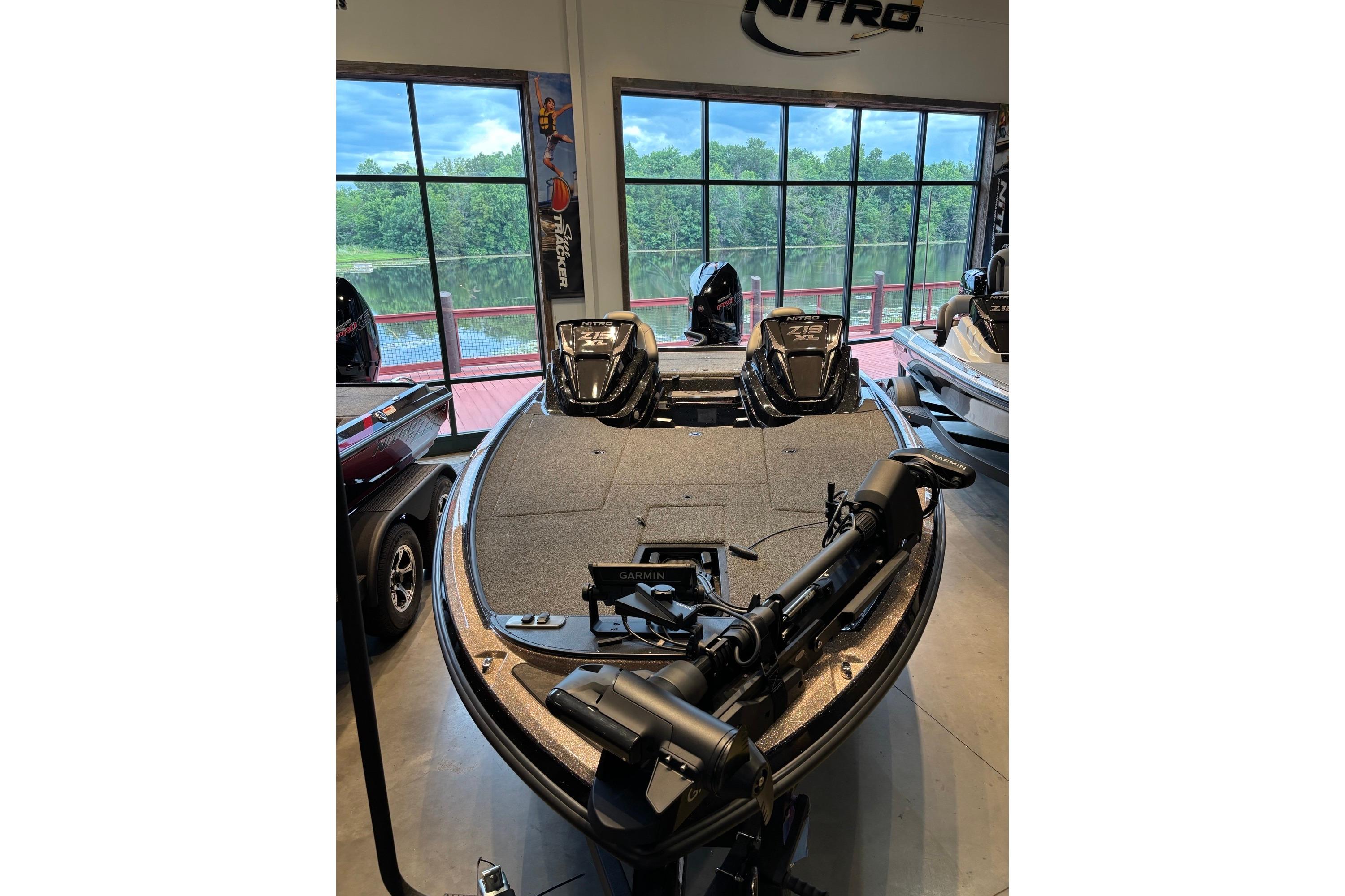 2026 Nitro Z19 XL Pro fishing boat displayed indoors with advanced equipment.