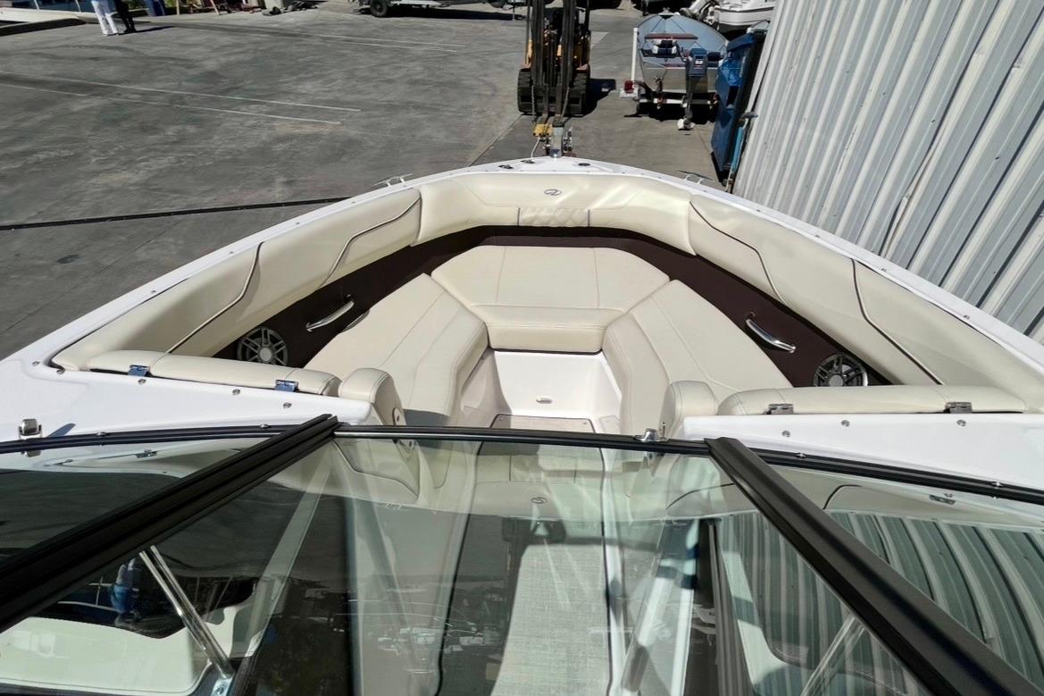 2025 Regal LX2 boat interior with beige seating and sleek design.