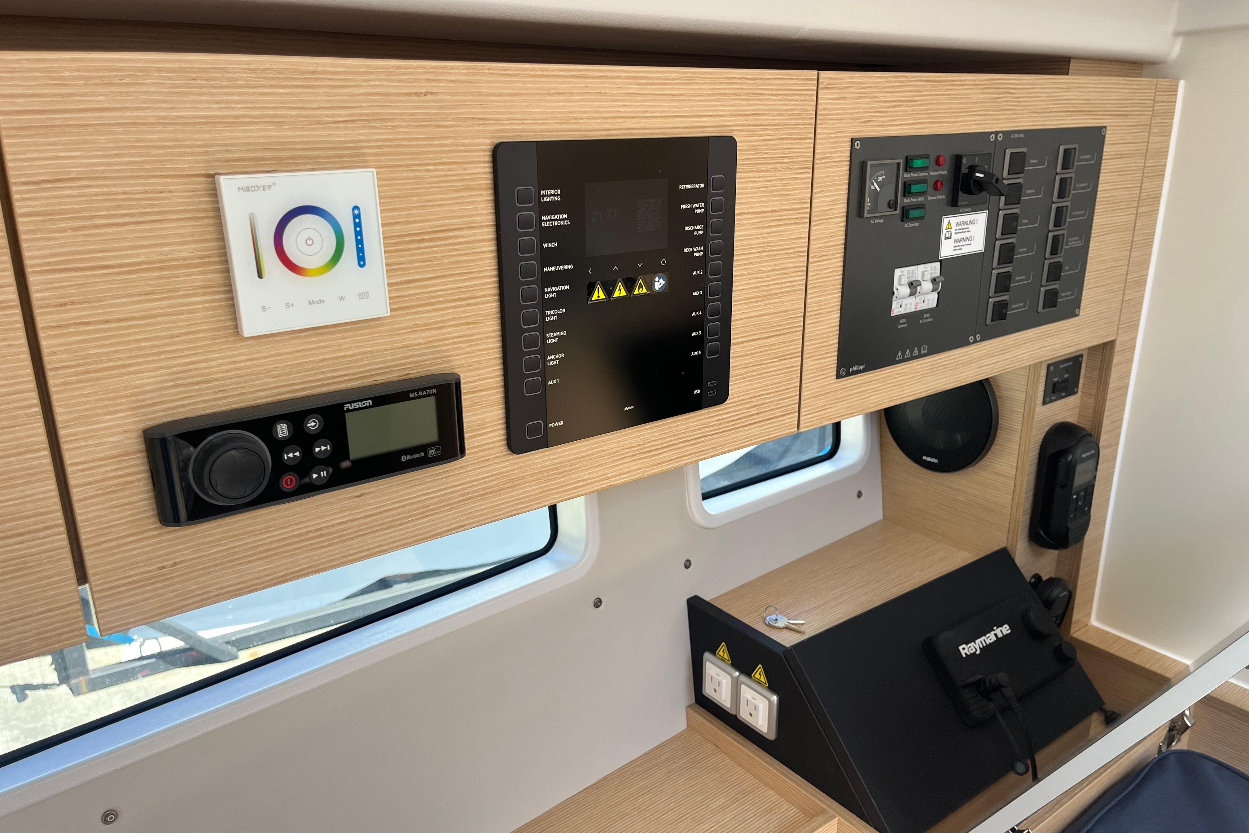 Control panel of 2025 Hanse 360 yacht with modern navigation and audio systems.