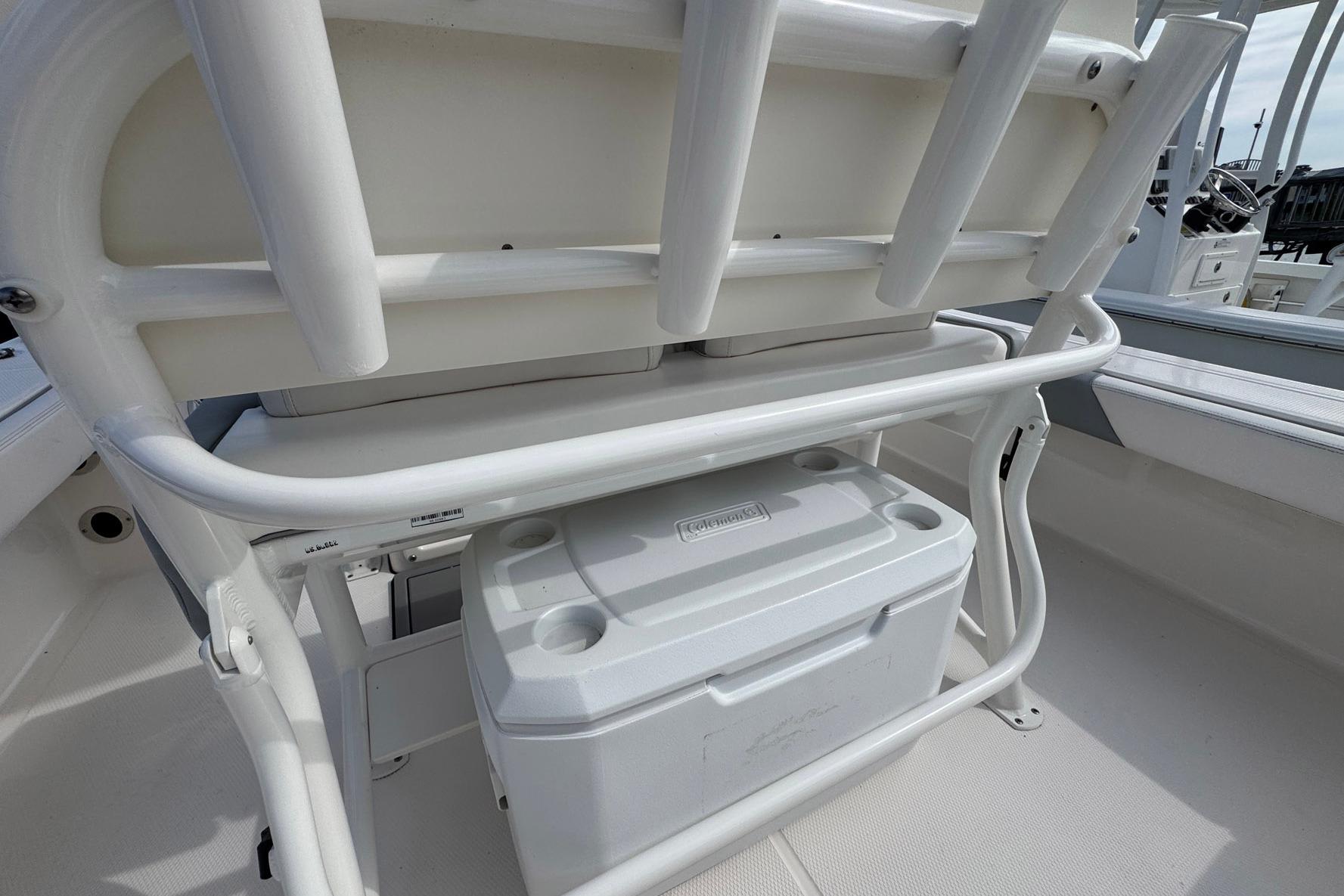 2021 Robalo 246 Cayman boat interior with cooler storage under seating.