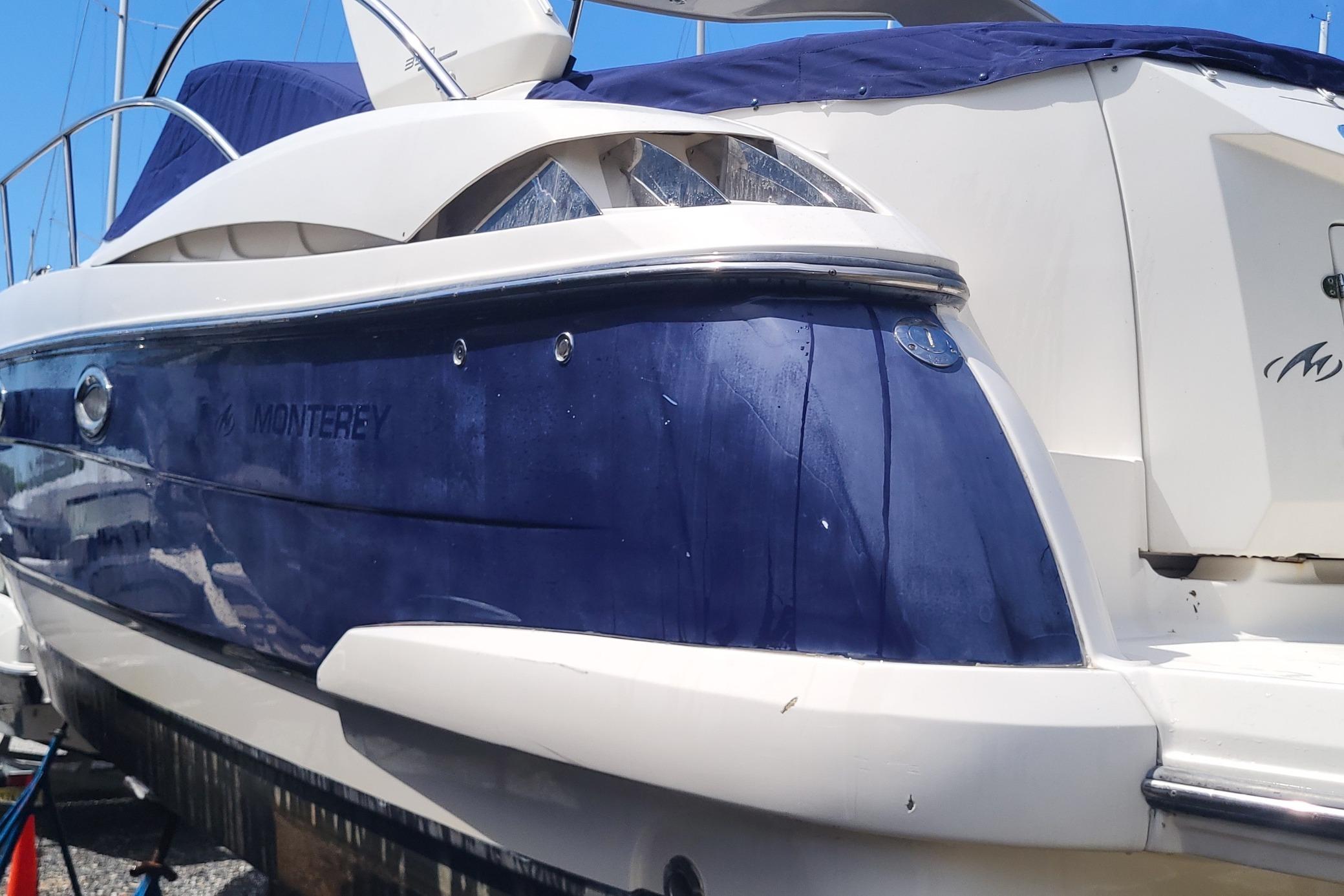2008 Monterey 350 Sport Yacht with blue and white exterior, docked under clear sky.