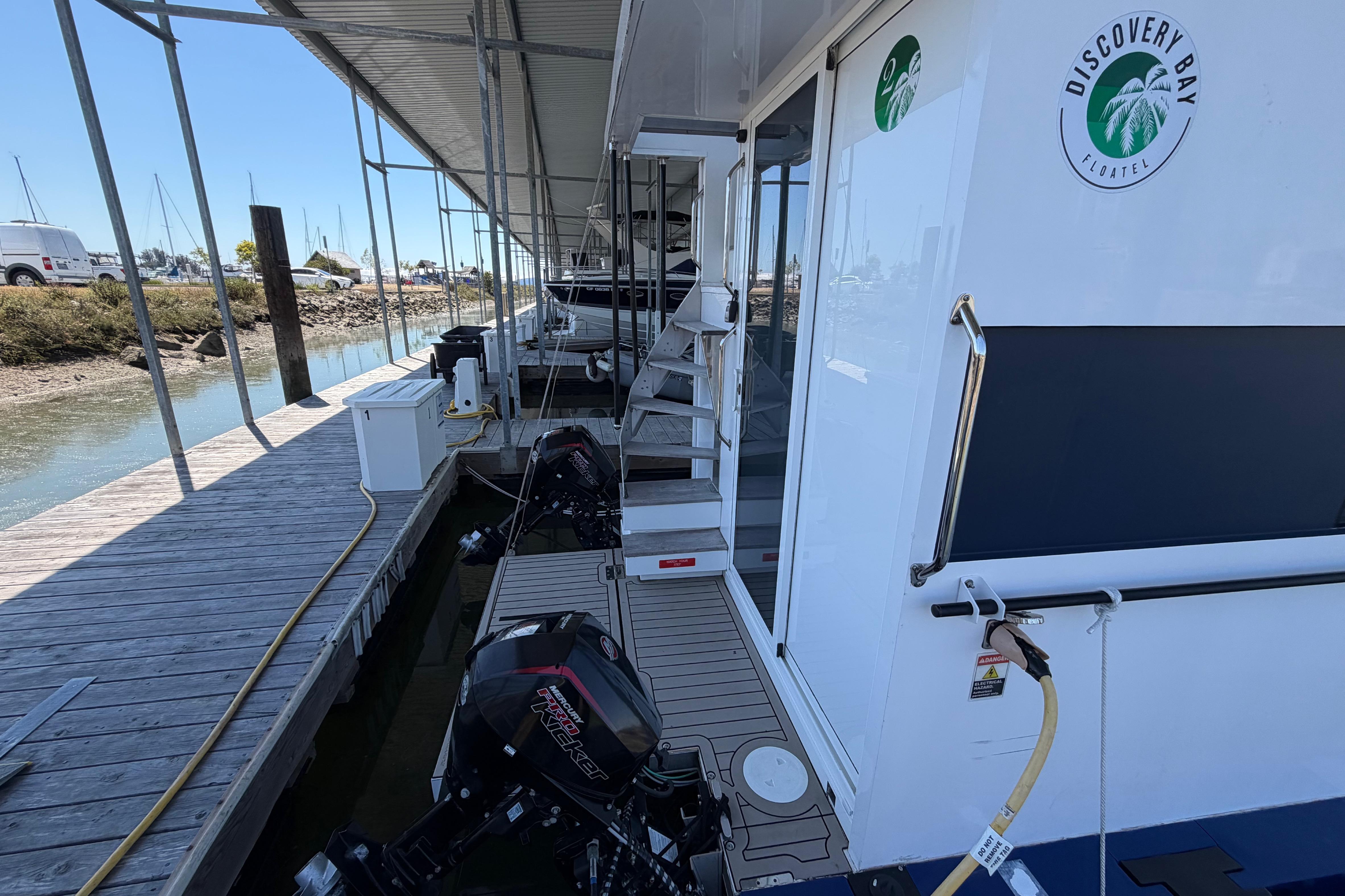 Navisyo NV.08 houseboat docked at Discovery Bay Floatel, 2022 model.