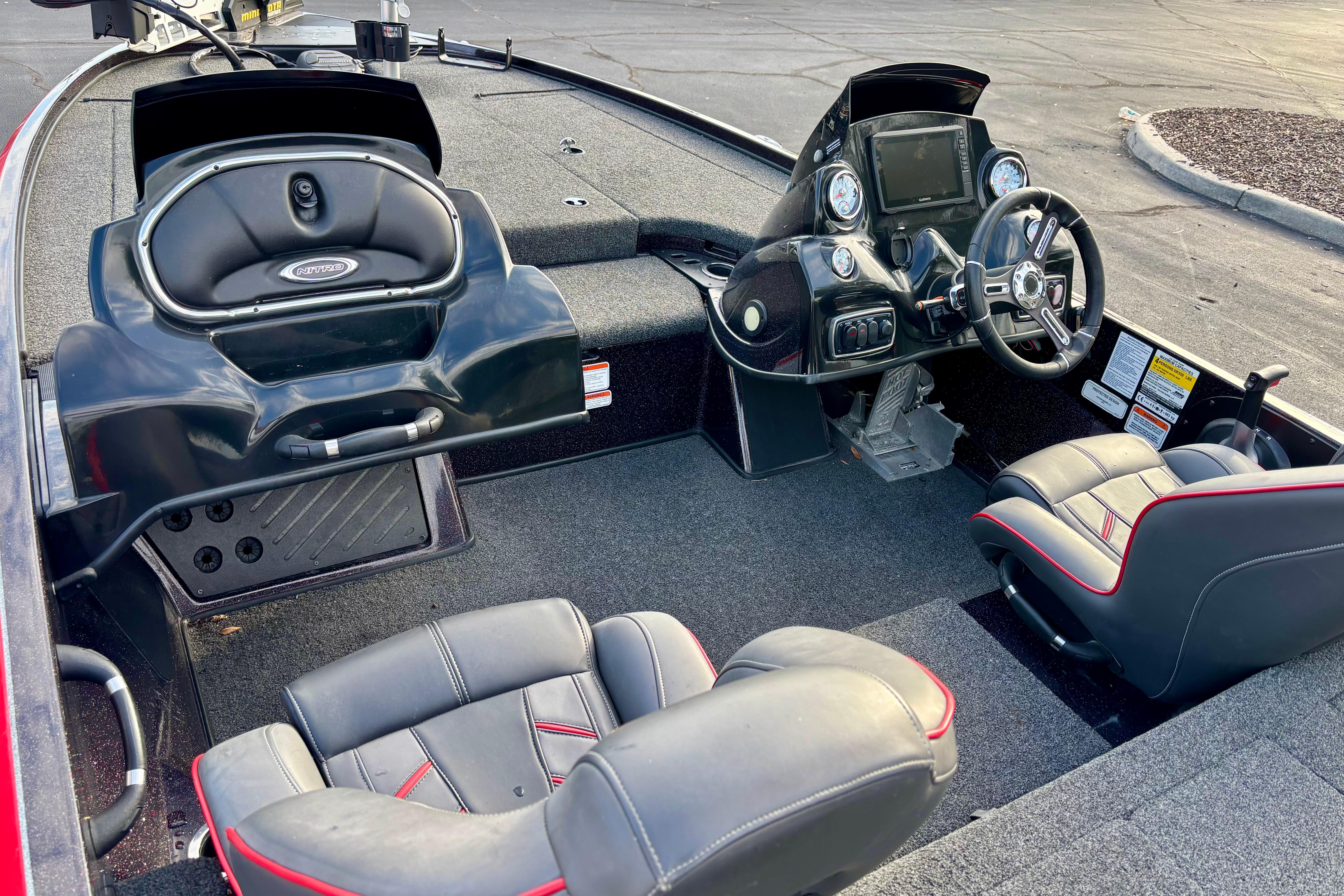 Interior of a 2018 Nitro Z18 boat with steering console and seating.