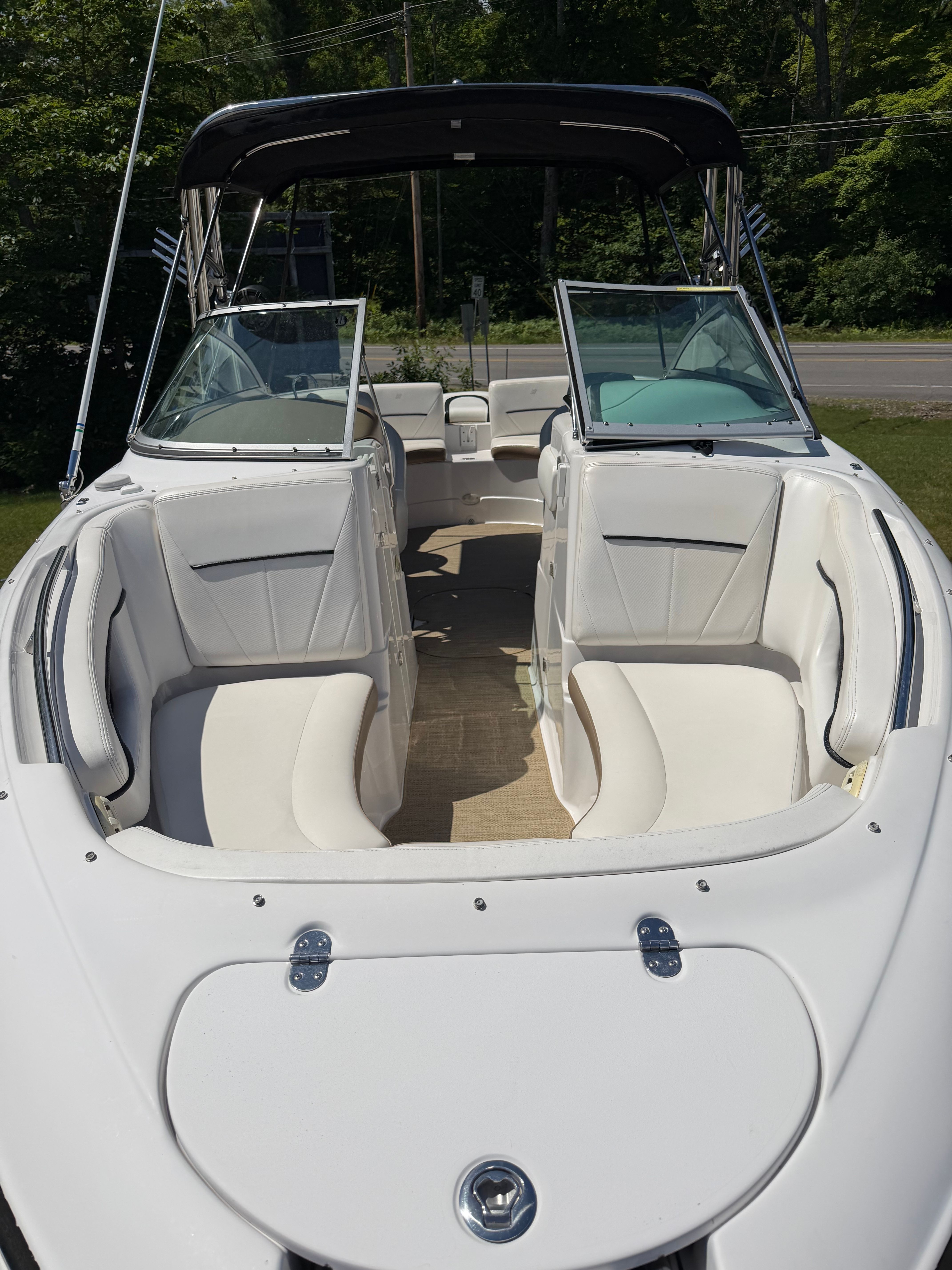 2008 Four Winns H240 Frenzy with open cabin and white upholstery.
