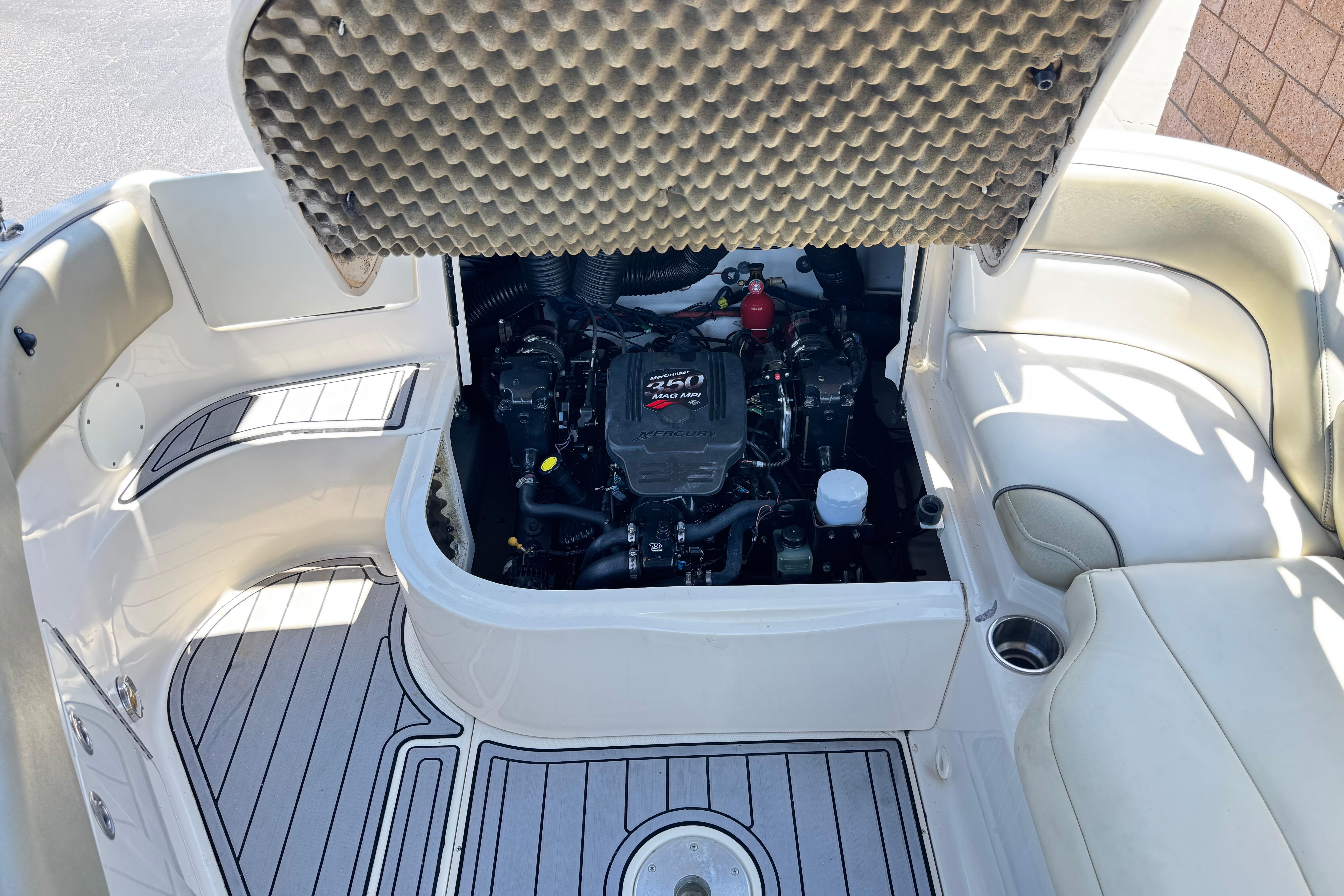 2007 Sea Ray 240 Sundeck engine compartment with open hatch, showcasing interior details.
